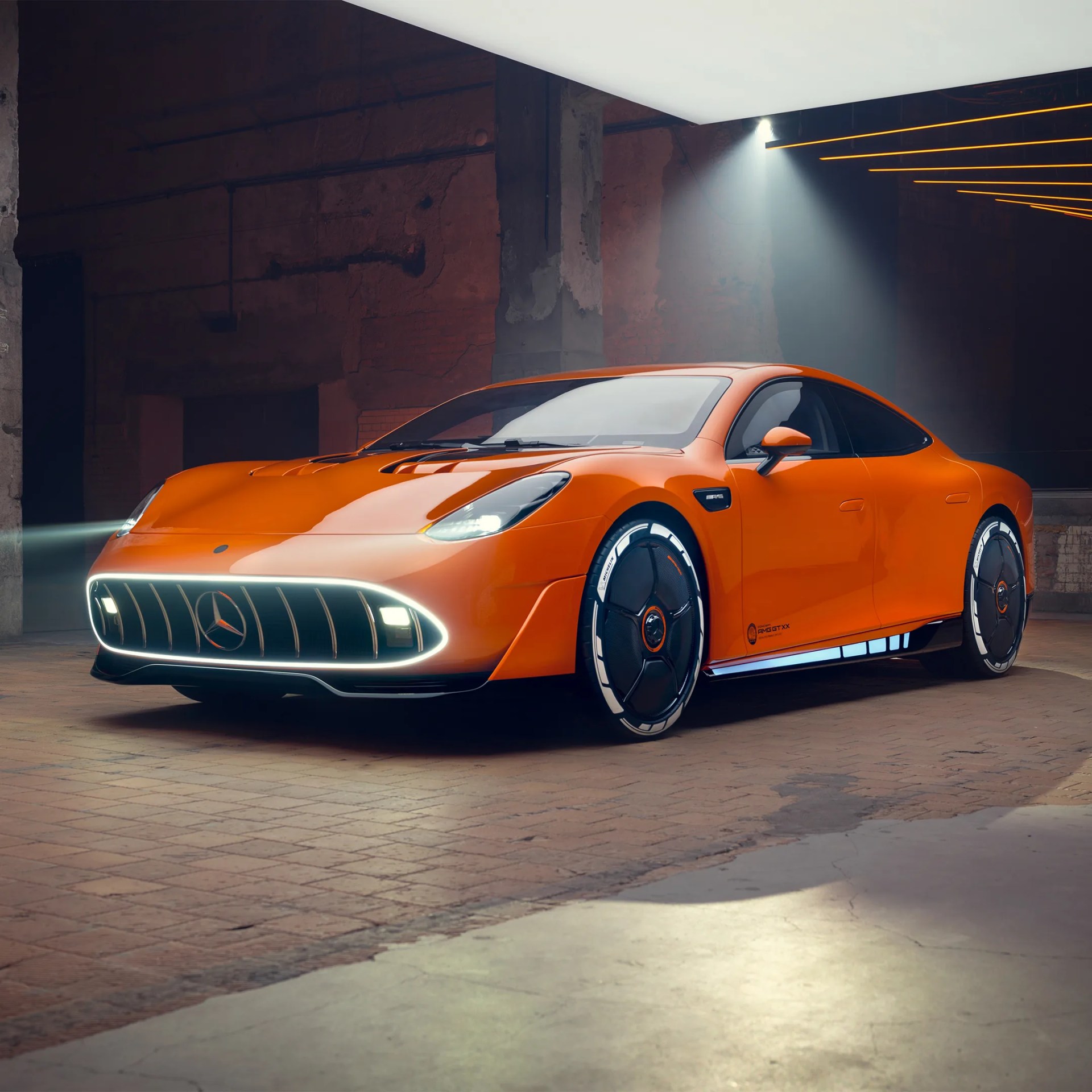 Orange futuristic Mercedes-Benz AMG electric sports car with illuminated grille and sleek aerodynamic design in a dimly lit industrial space.
