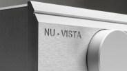Close-up of a brushed metal panel with "NU-VISTA" engraved and a large silver control knob.