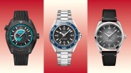 Three Omega wristwatches: left black Seamaster with turquoise accents and textured strap, center silver Seamaster with blue bezel and metal bracelet, right silver Railmaster with black leather strap and gray dial.