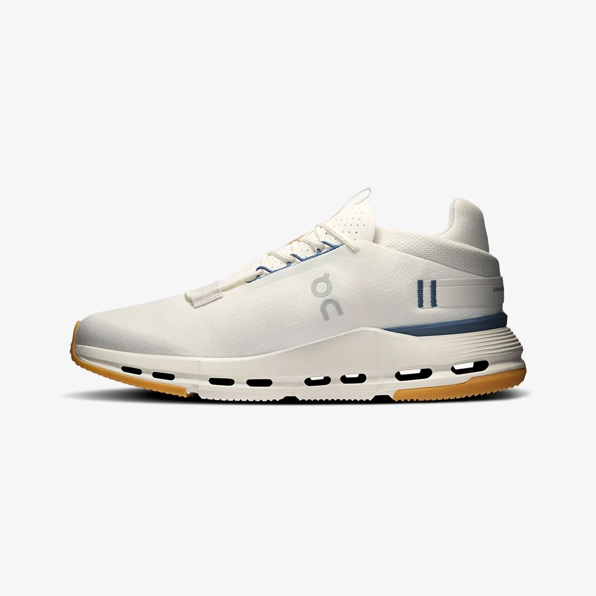 White and blue athletic sneaker with gum sole and ventilation holes in the midsole.