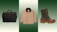 Dark olive green waxed canvas messenger bag with black strap, tan waxed cotton jacket with dark brown corduroy collar, and olive green and brown lace-up winter boot with Vibram sole.