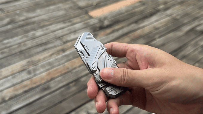 Someone deploying the TiGo SyncraBlade in front of a wooden deck.