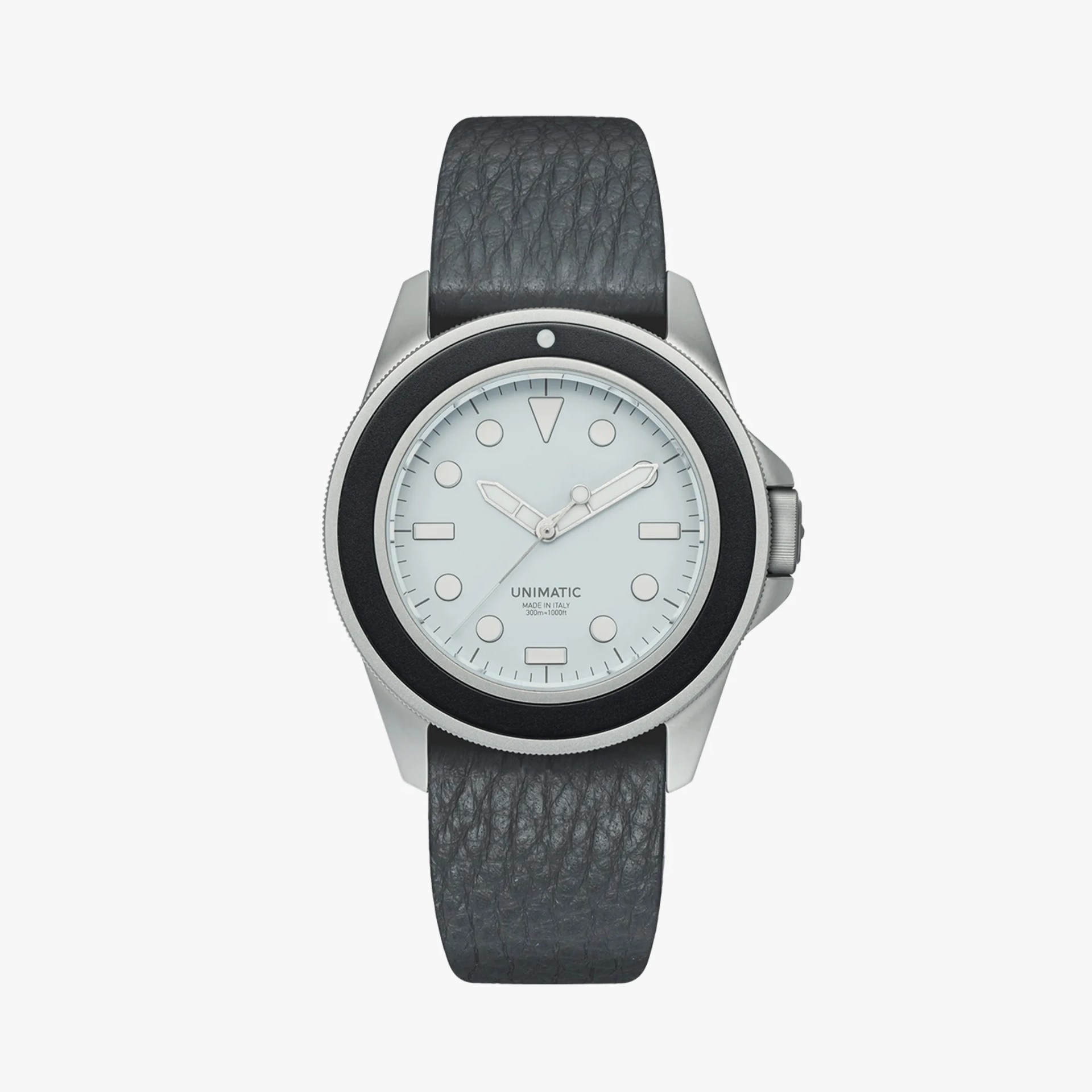 Silver Unimatic wristwatch with white dial, black bezel, and textured dark gray leather strap.