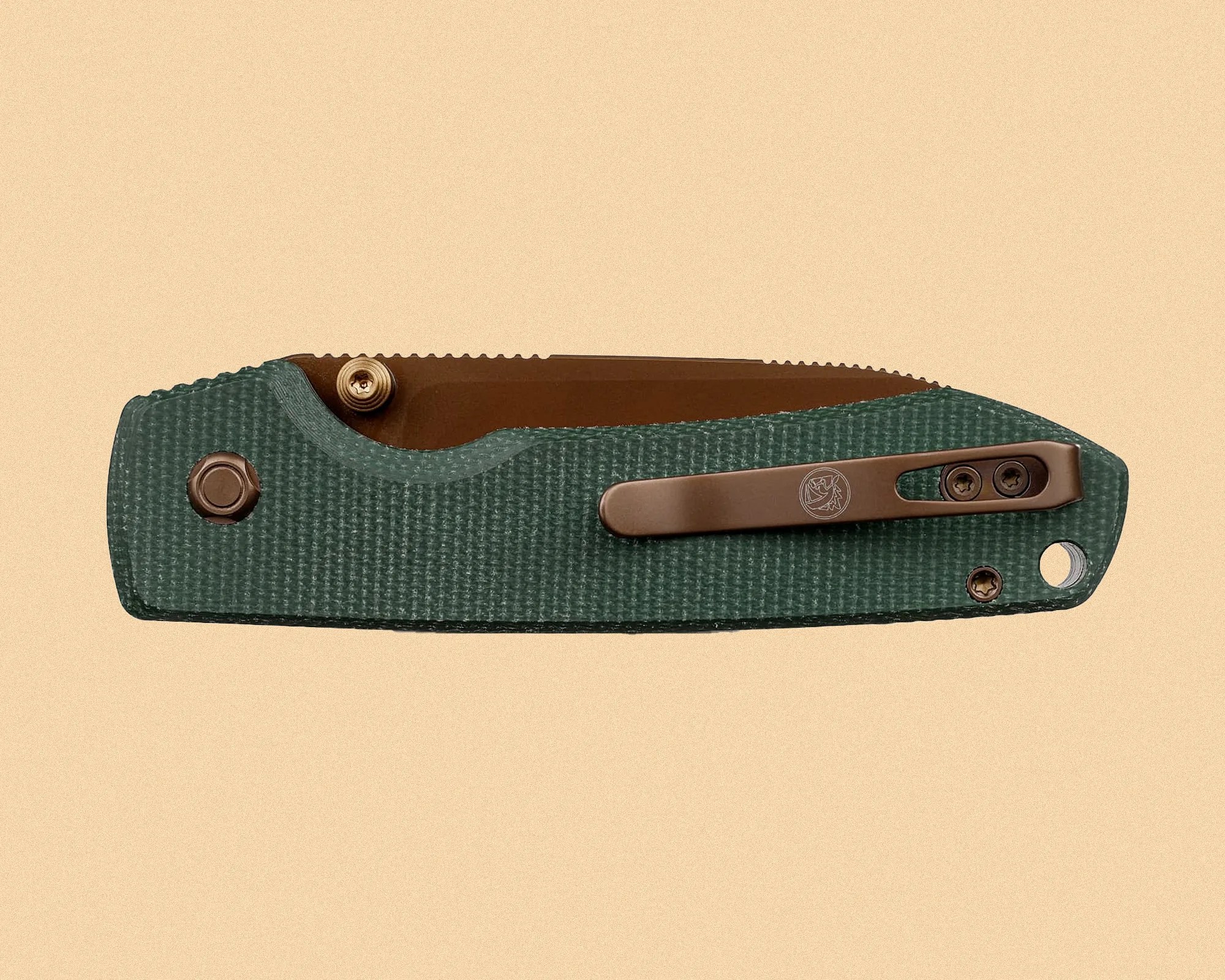 Folded green textured pocket knife with bronze clip and partially visible bronze blade on beige background.