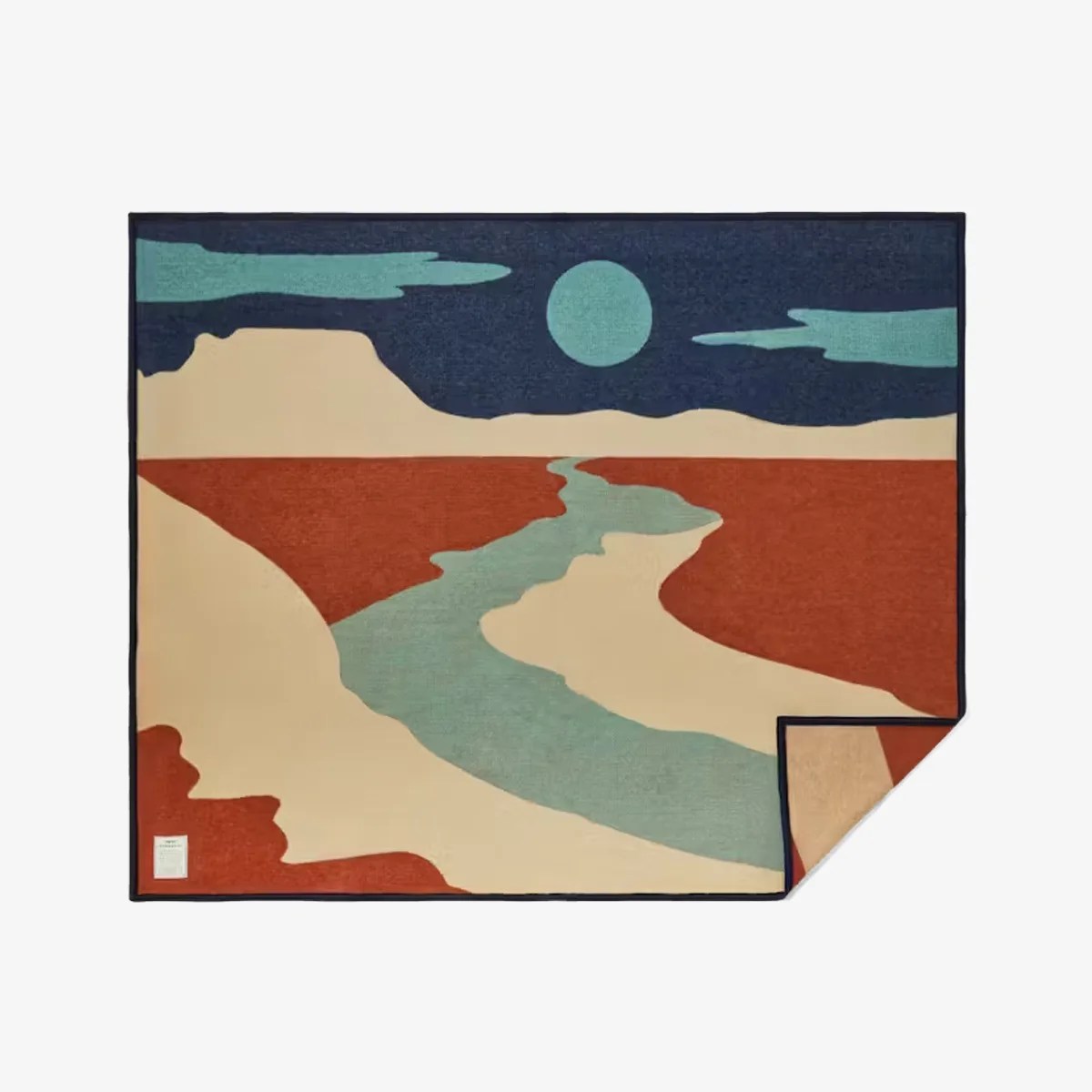 Rectangular rug with abstract desert landscape design in blue, beige, rust, and teal colors.