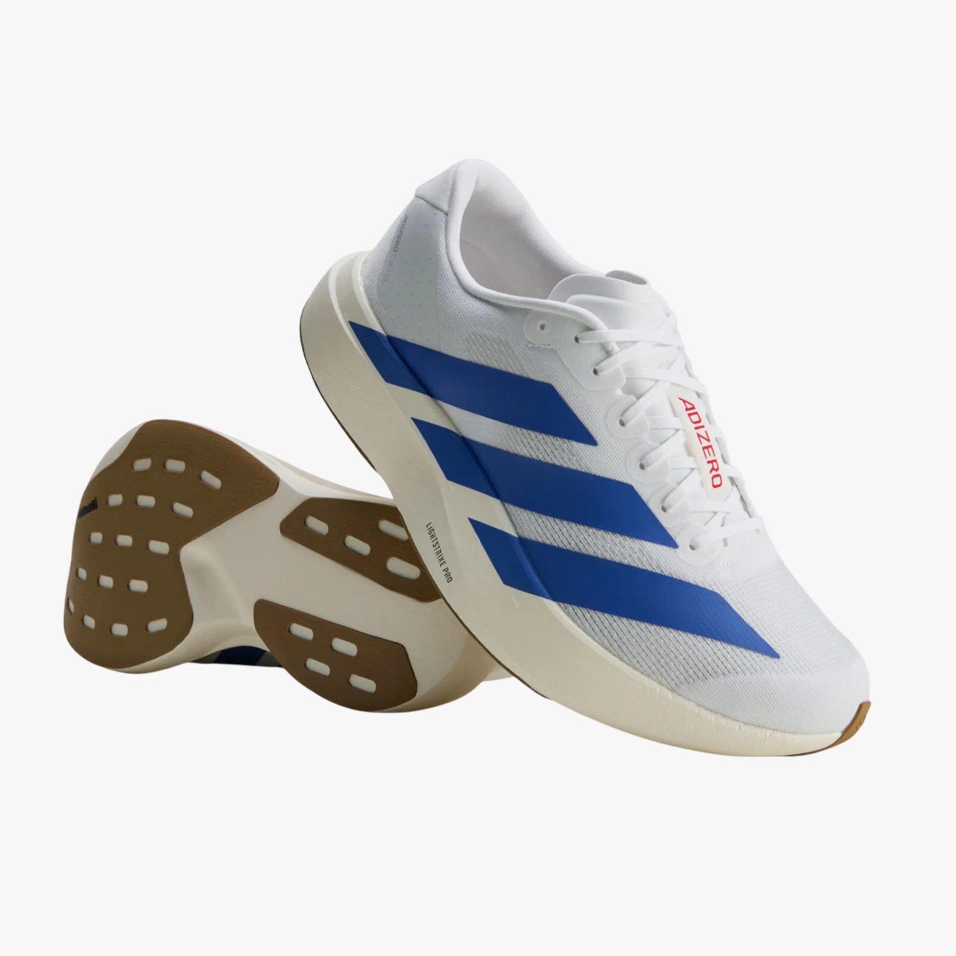 White running shoes with blue stripes, beige soles, and "ADIZERO" in red on the tongue.