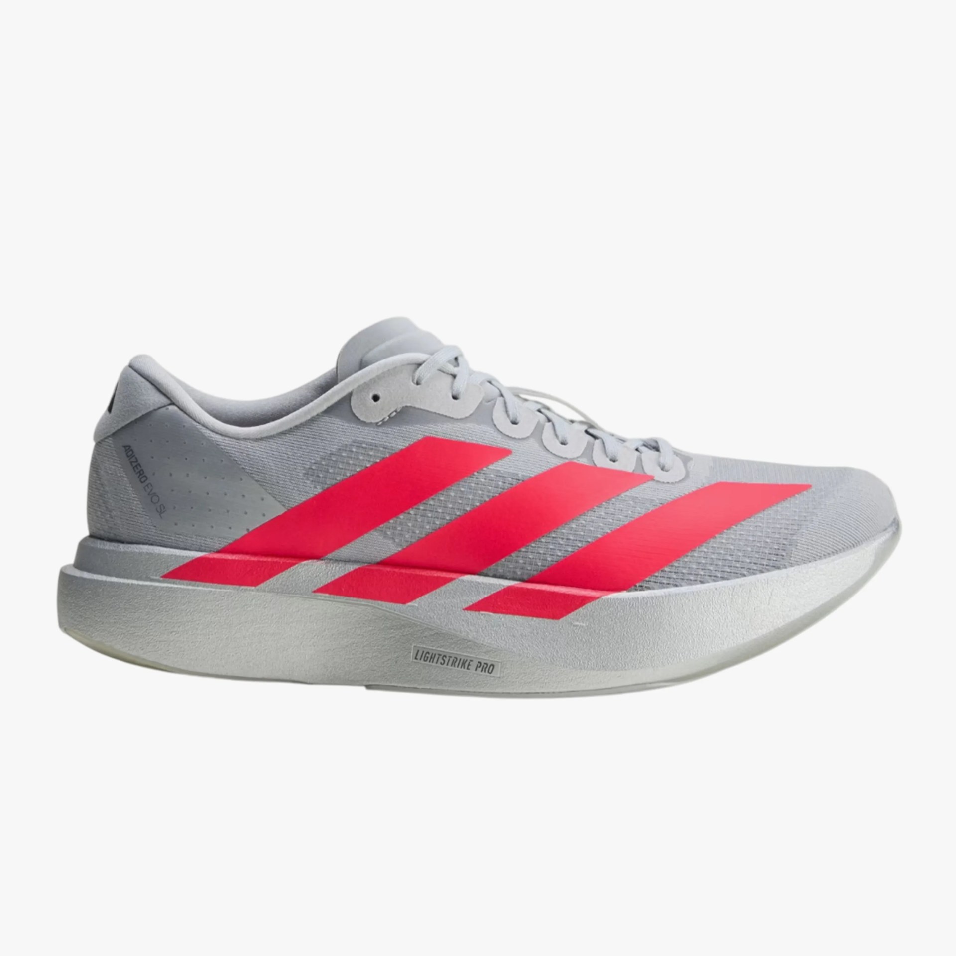 Light gray Adidas running shoe with bright red stripes and thick white sole labeled Lightstrike Pro.