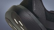 Close-up of the black Adidas Adizero Evo SL running shoe heel with textured sole and perforated upper.