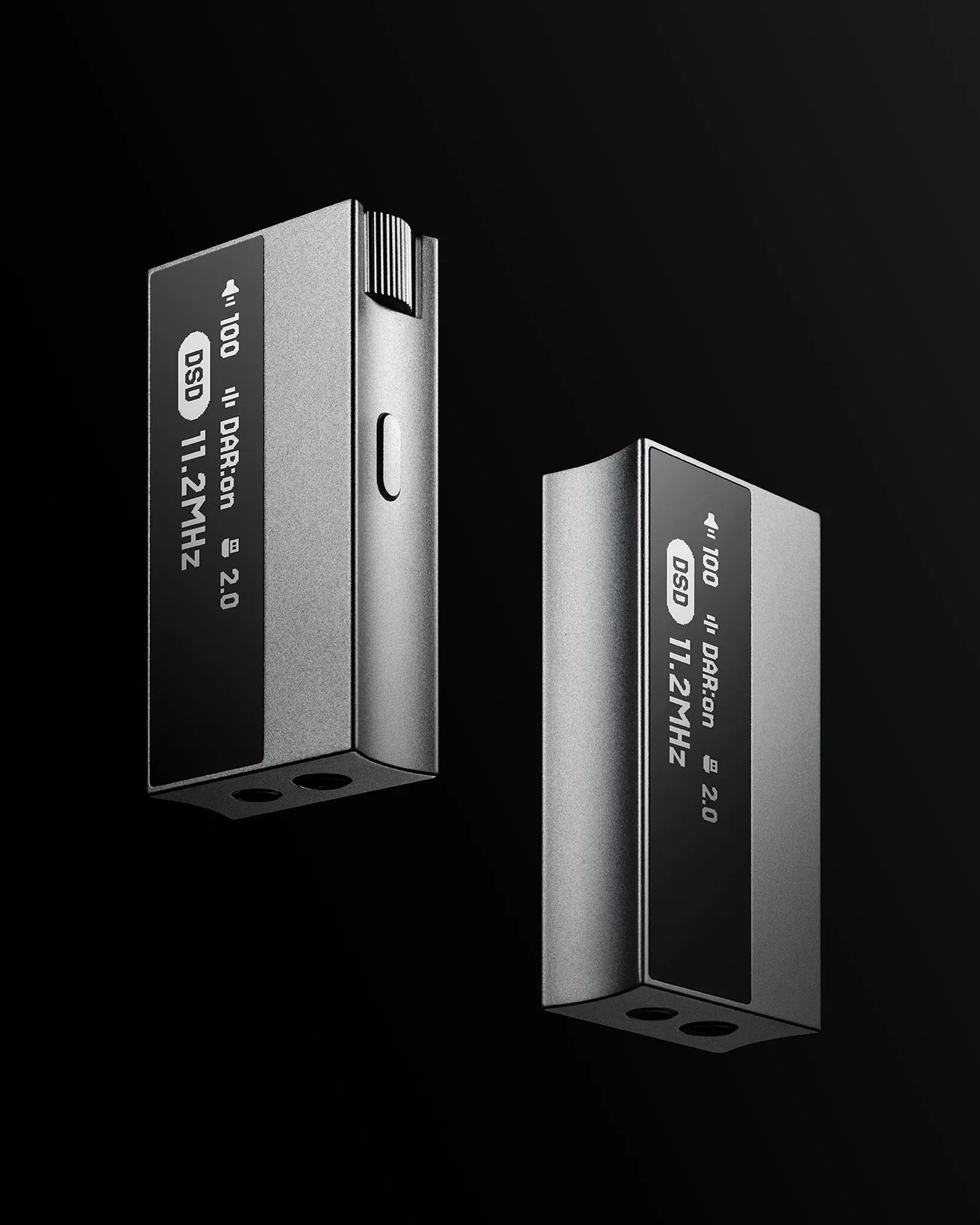 Two silver digital audio devices with black screens displaying "DSD 11.2 MHz" on a black background.