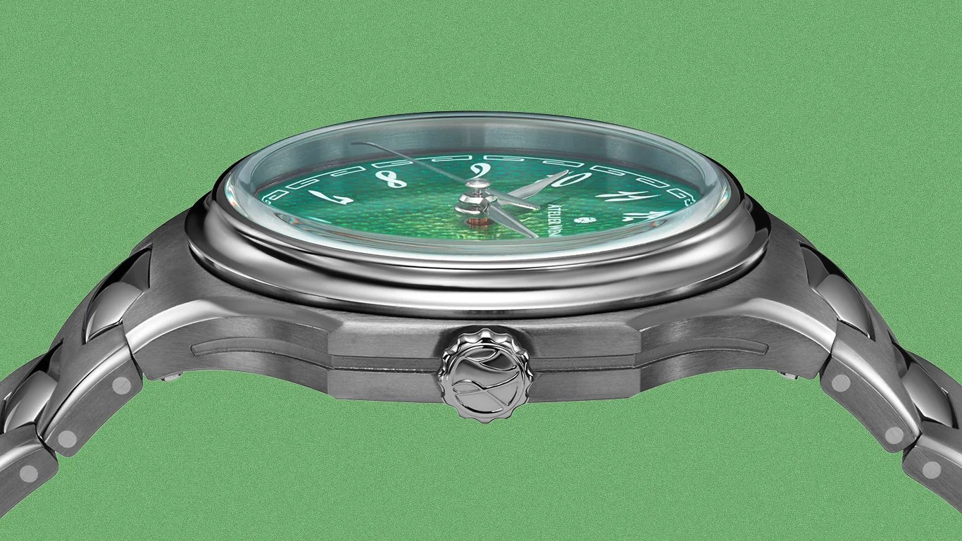 Side view of a silver metal wristwatch with a green textured dial and a crown featuring a wave-like logo.