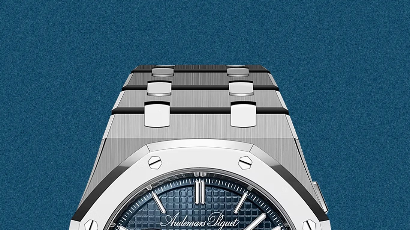 Silver stainless steel Audemars Piguet watch with blue textured dial and metal bracelet.