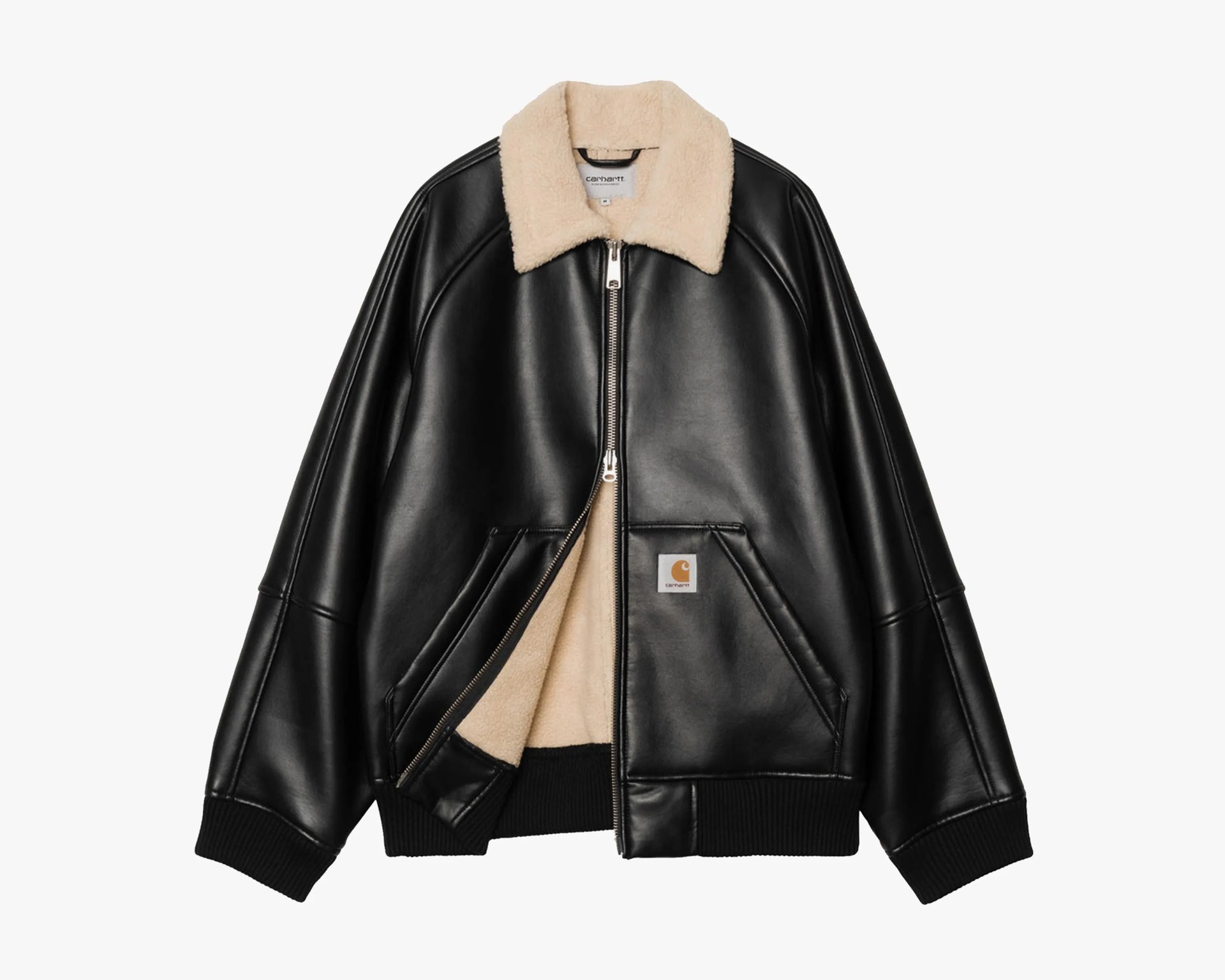 Black leather bomber jacket with beige shearling collar and lining, front zipper, and Carhartt logo patch on pocket.