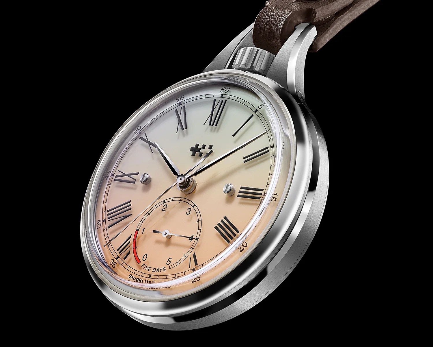Silver pocket watch with a gradient beige dial, black Roman numerals, and a brown leather strap.