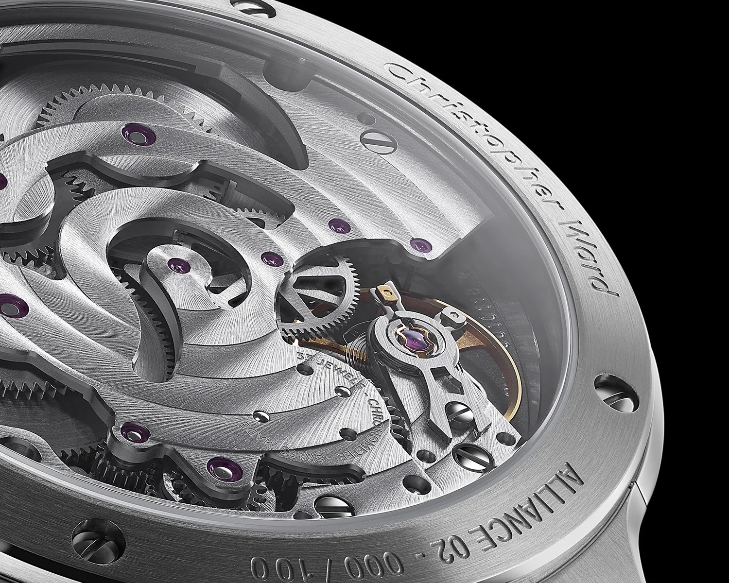 Close-up of a silver watch movement with visible gears and purple jewels inside a stainless steel case engraved with "Christopher Ward" and "ALLIANCE 02 - 000/100".