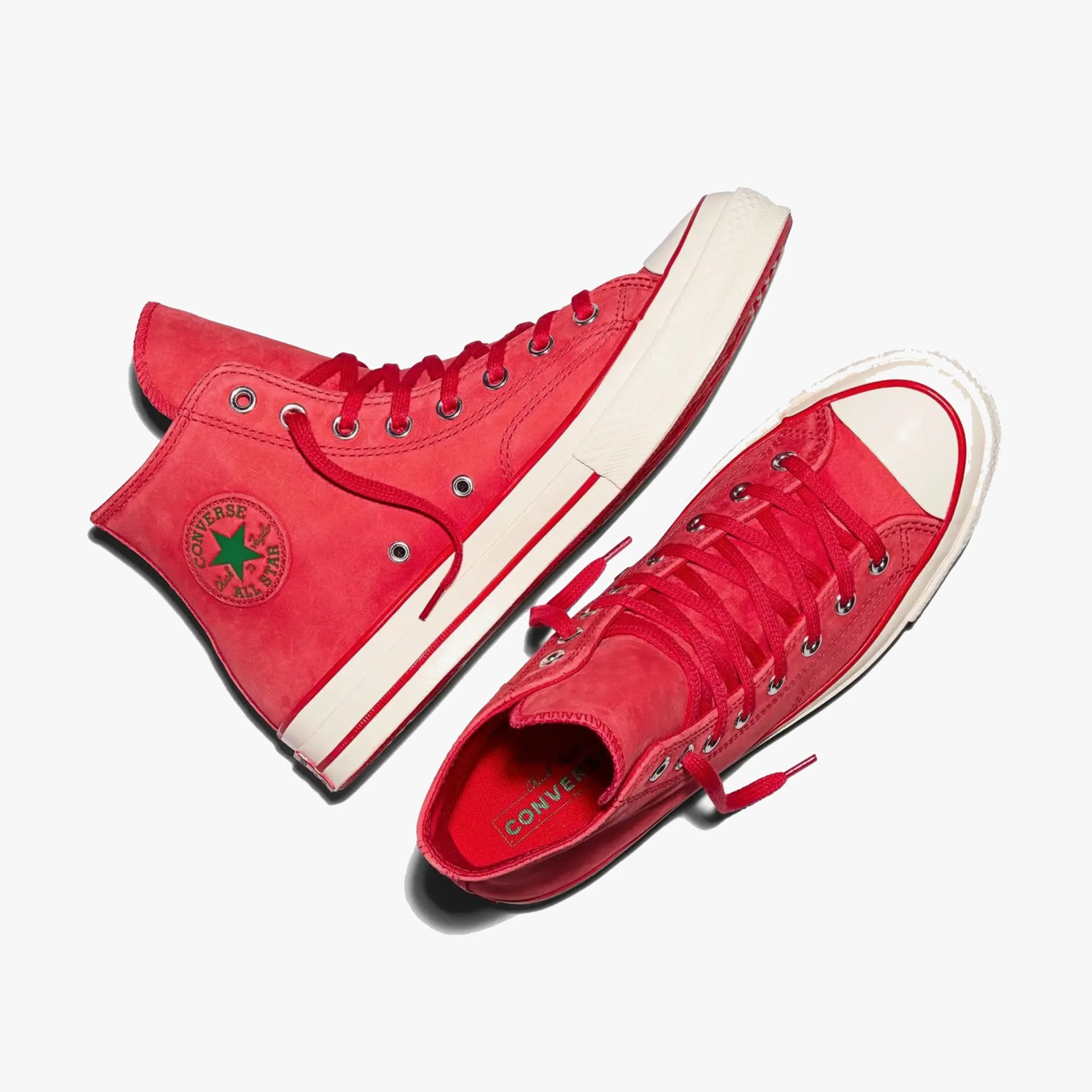 Pair of red high-top Converse All Star sneakers with white rubber soles and toe caps.