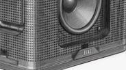 Close-up of a black speaker with a perforated grille and the brand name "ELAC" on the bottom front.