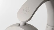 Close-up of light gray headphone arm with "final" logo and hexagonal design.