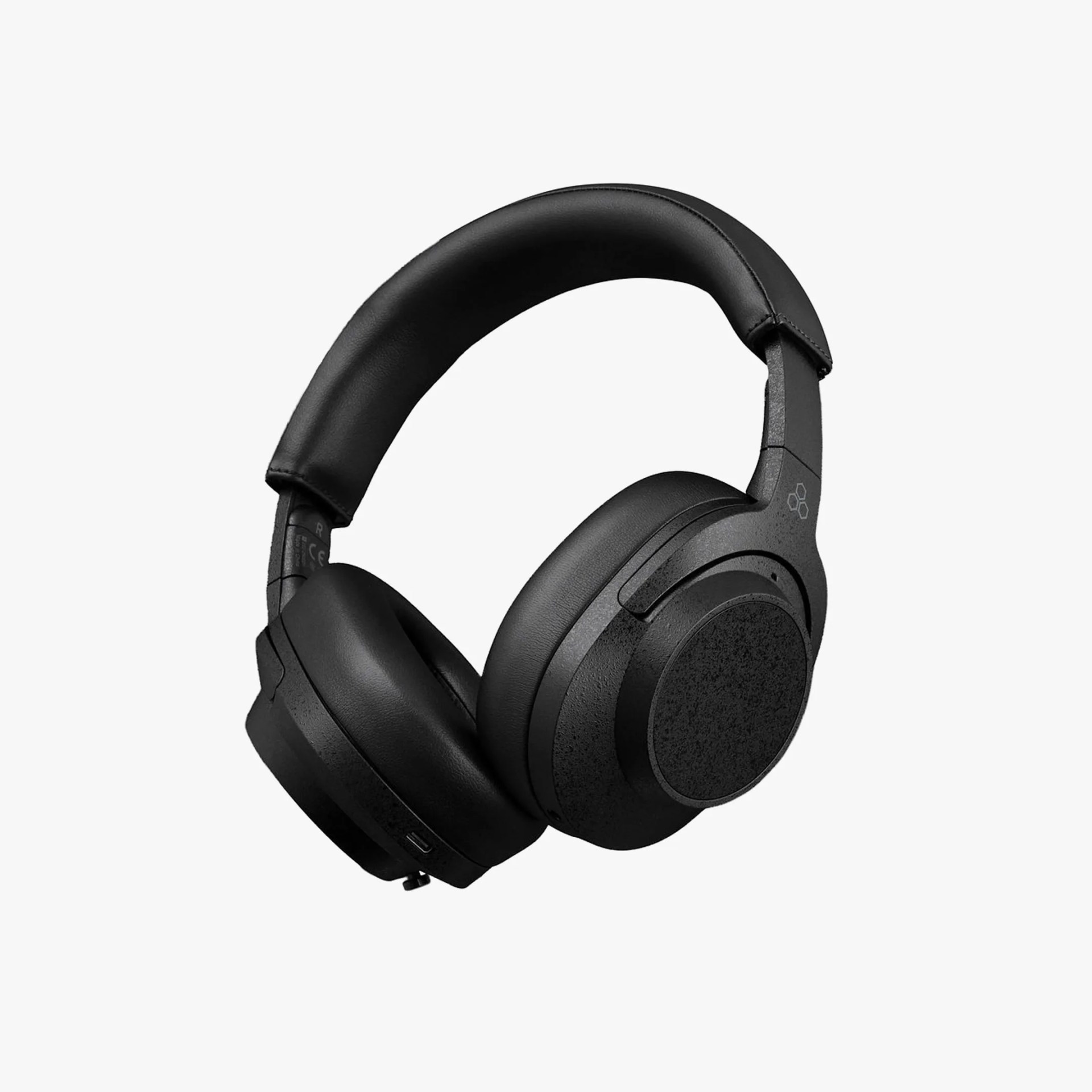 Black over-ear wireless headphones with padded headband and ear cushions against a white background.