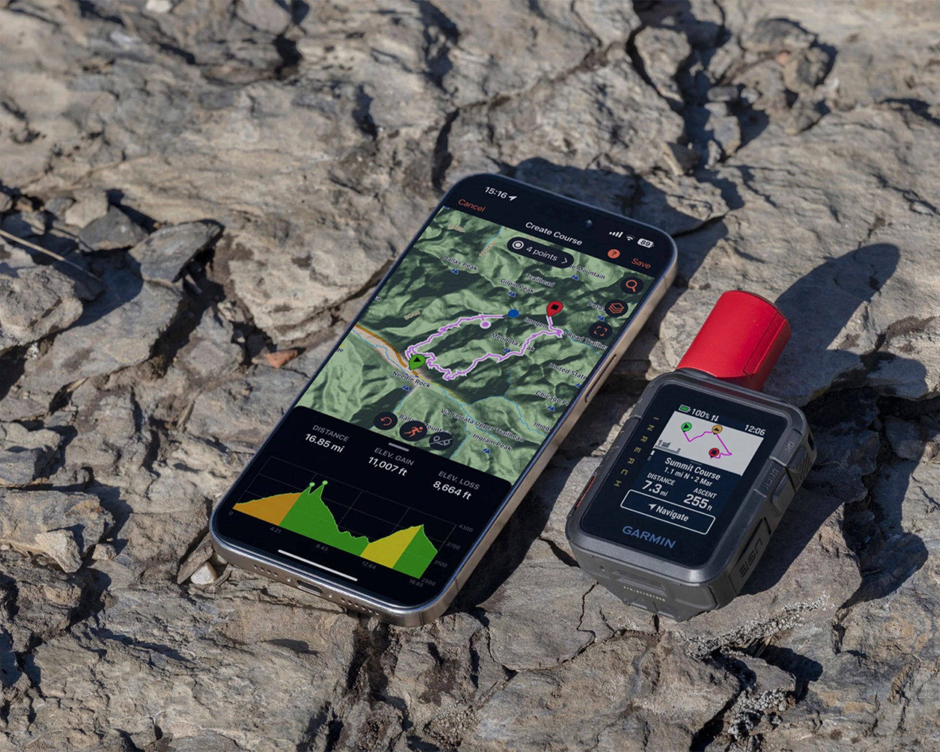 Smartphone displaying a hiking map and elevation chart next to a Garmin inReach GPS device on rocky ground.