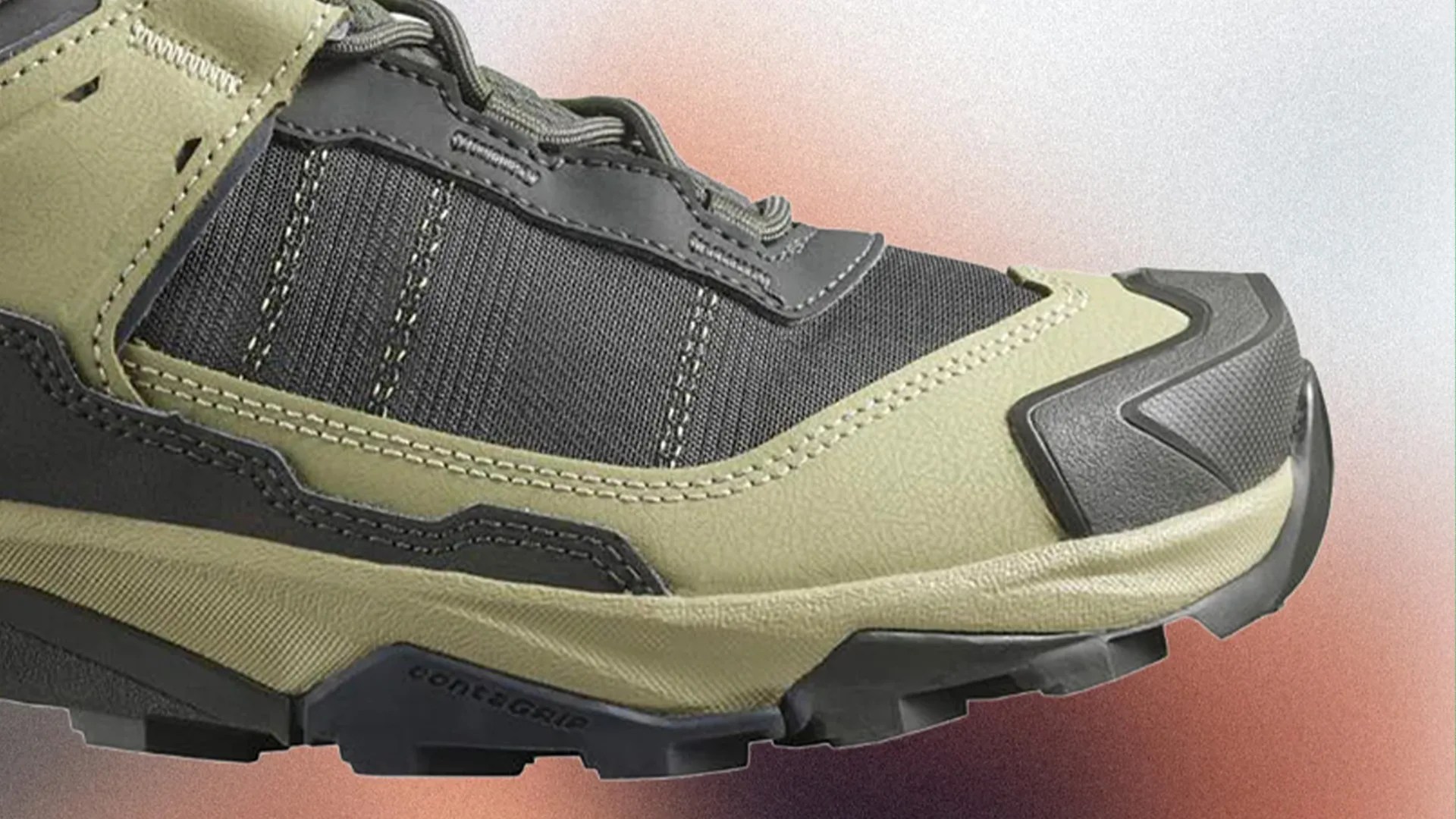 Close-up of a beige and black hiking shoe with textured sole and Contagrip branding on the side.