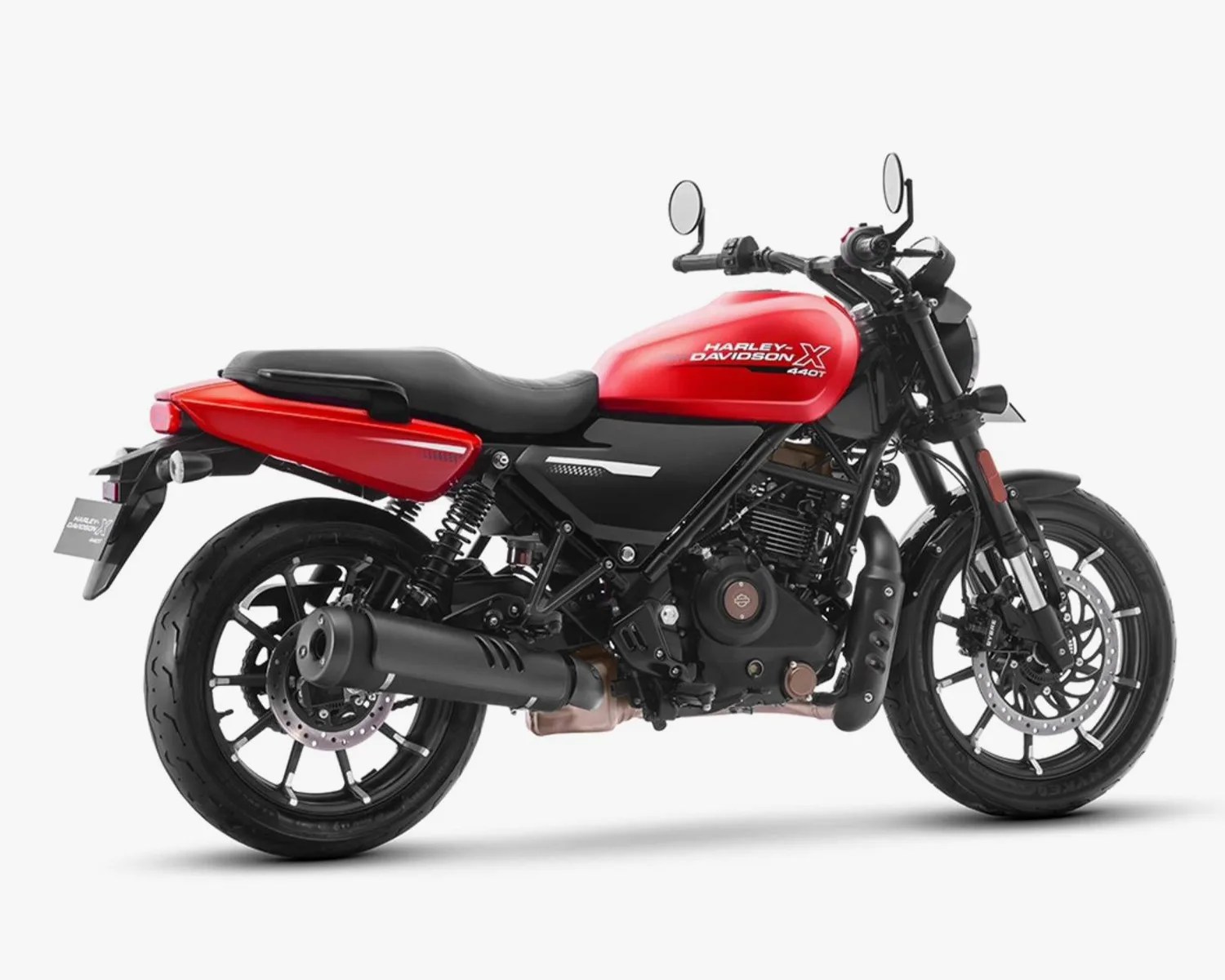 Red and black Harley-Davidson X 440T motorcycle with black exhaust and dual rear shocks on white background.
