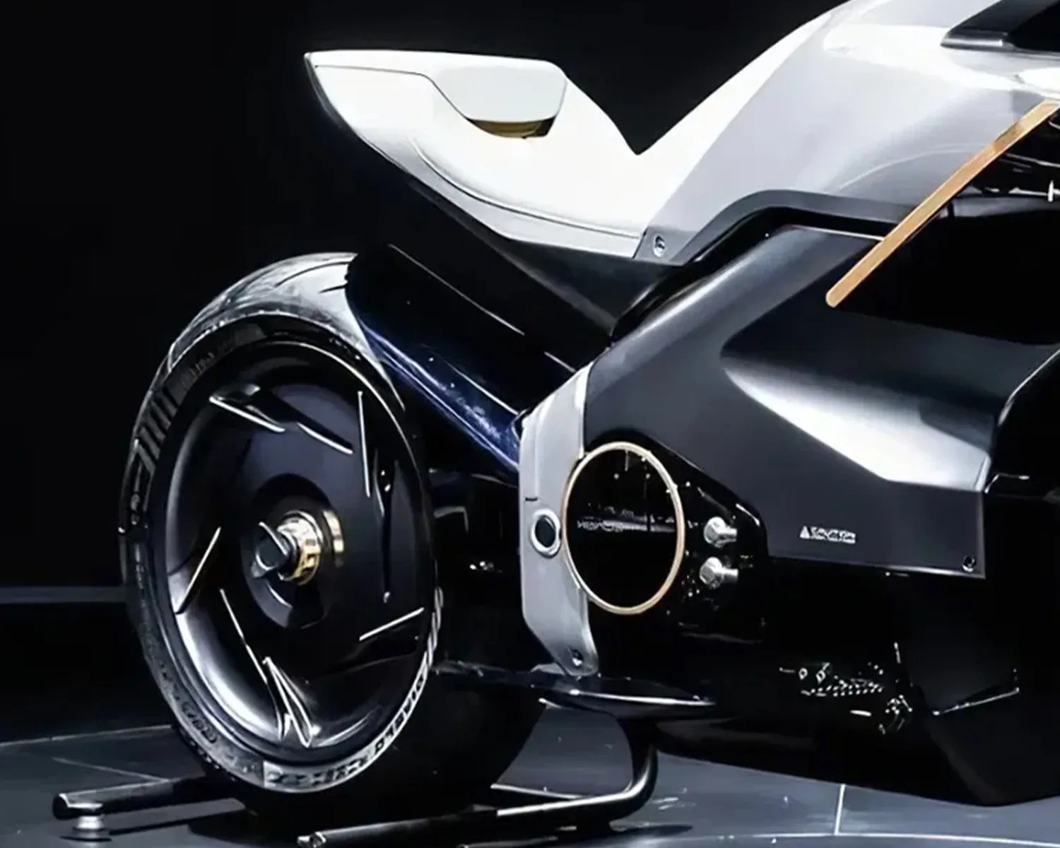 Close-up of the rear section of a black and white futuristic motorcycle with a solid rear wheel and a sleek white seat.