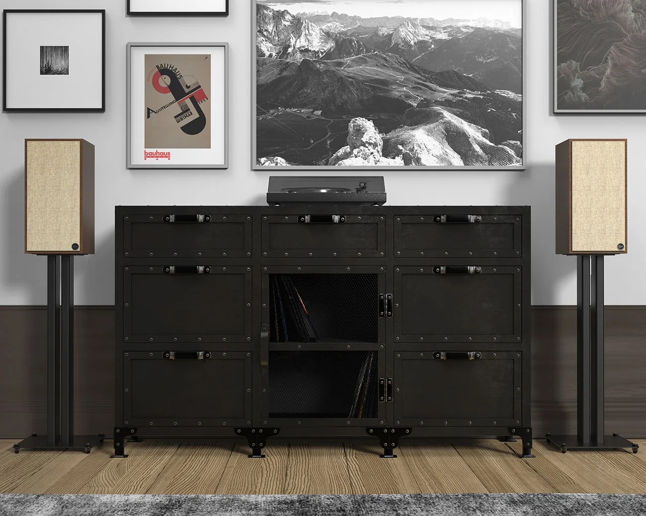 Black metal industrial-style cabinet with rivets and mesh doors, flanked by beige fabric-covered speakers on black stands.
