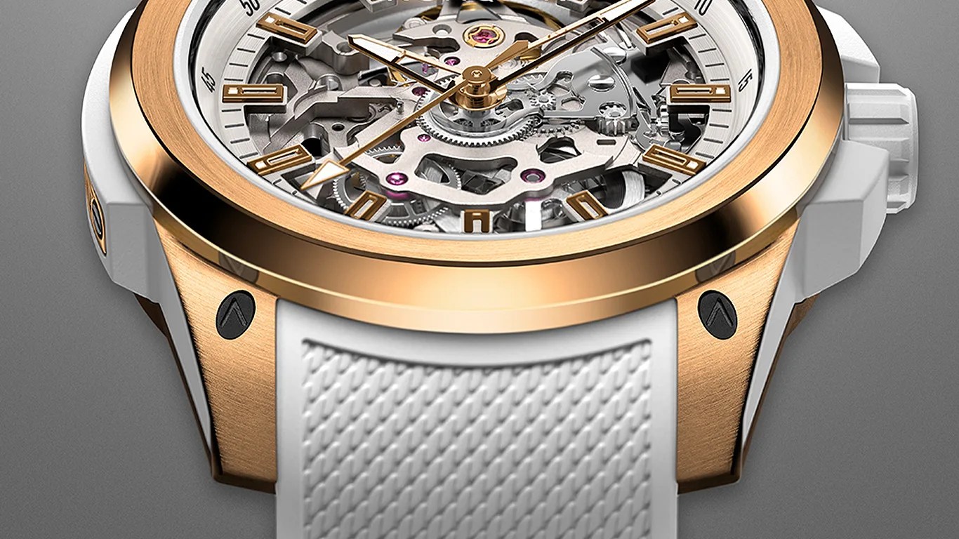 Close-up of a skeleton watch with a rose gold bezel and white textured rubber strap.