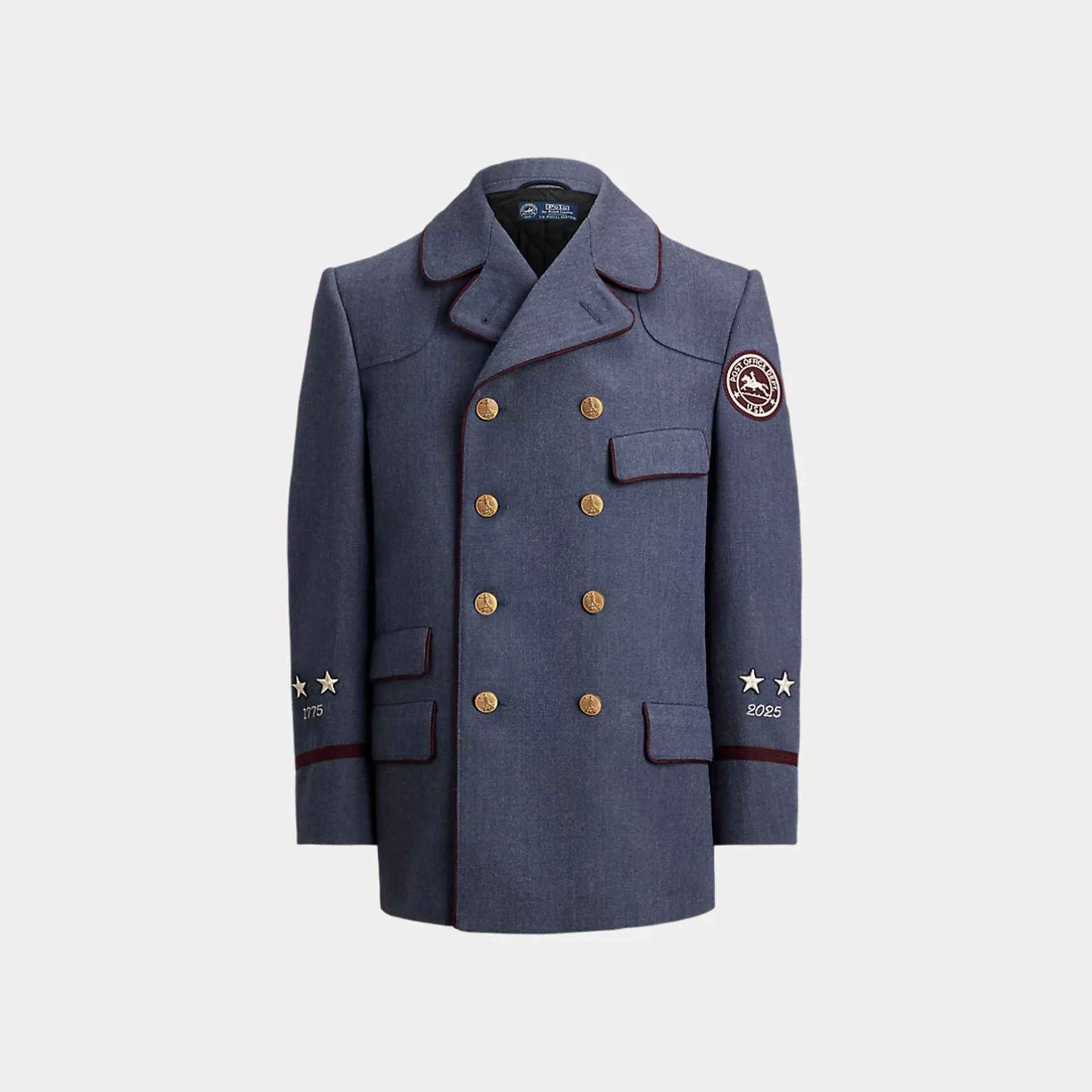 Double-breasted navy blue wool coat with gold buttons, maroon piping, and embroidered stars and patches on sleeves.
