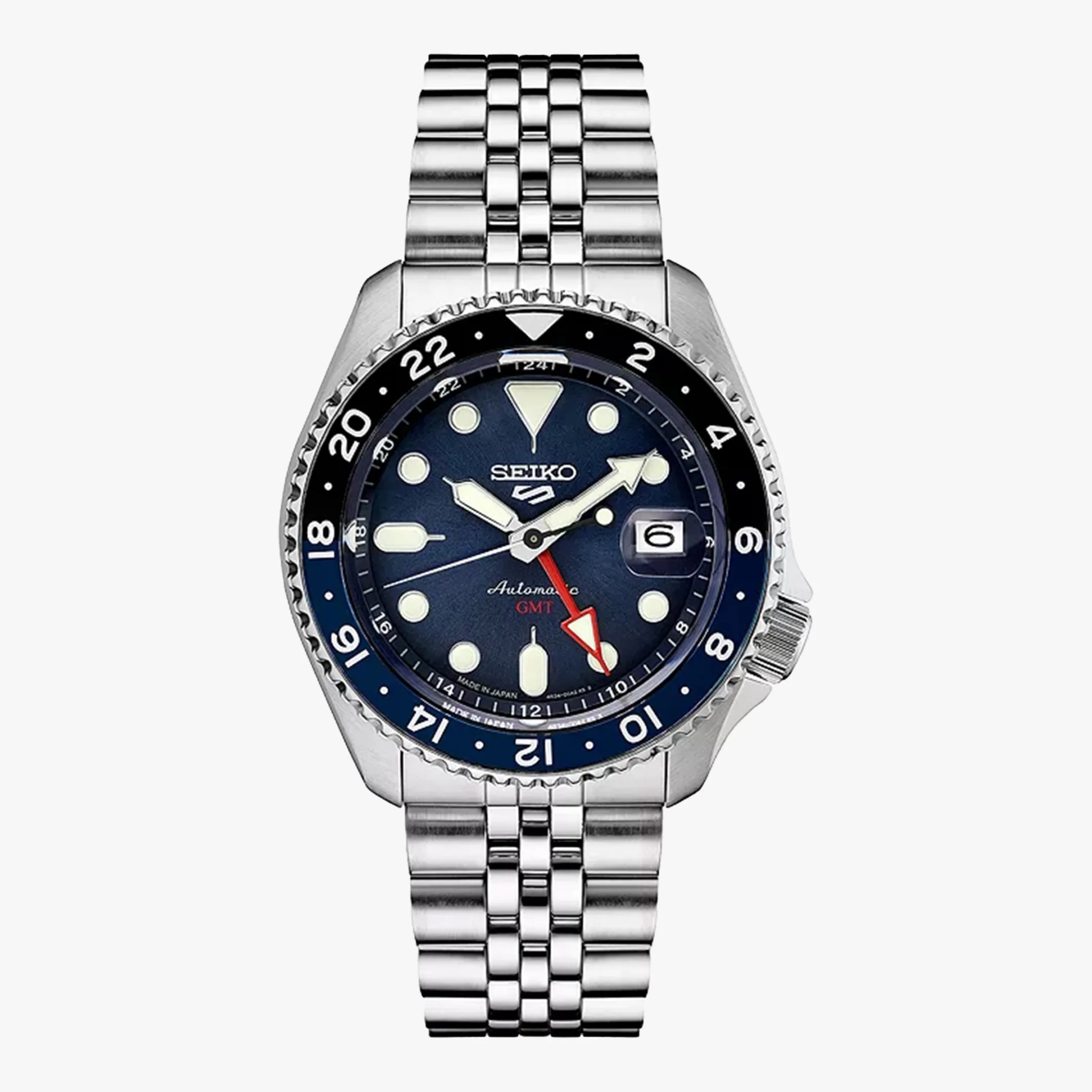 Seiko stainless steel GMT watch with blue and black bezel and blue dial with luminous markers.