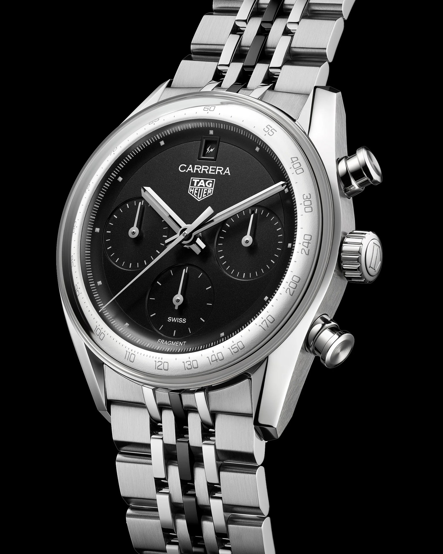 Silver TAG Heuer Carrera chronograph watch with black dial and stainless steel bracelet on black background.