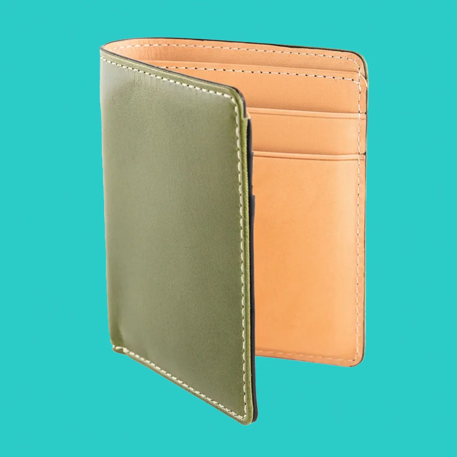 Green leather bifold wallet with tan interior and card slots against turquoise background.