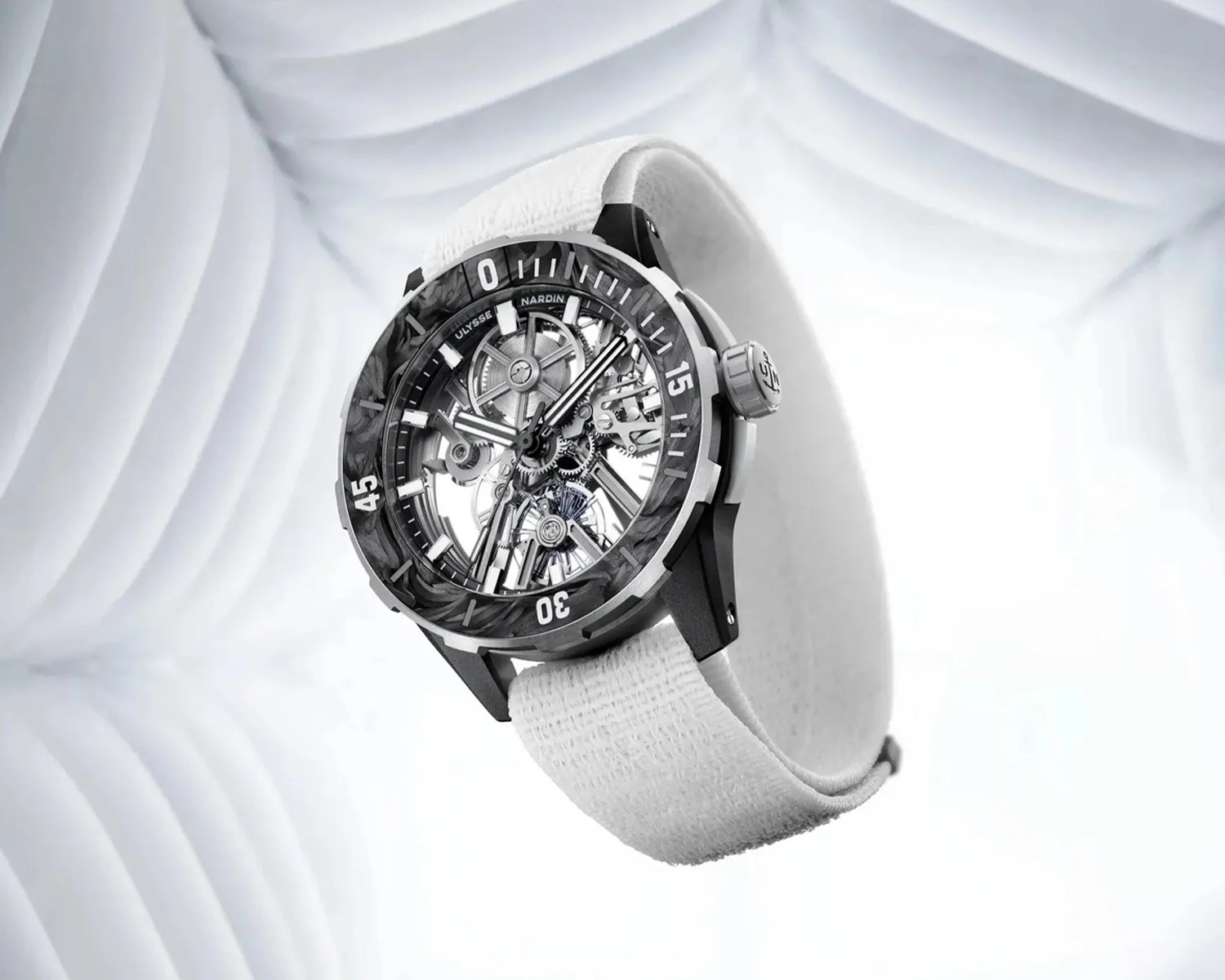 Skeleton dial wristwatch with black carbon bezel and white textured strap on a white abstract background.