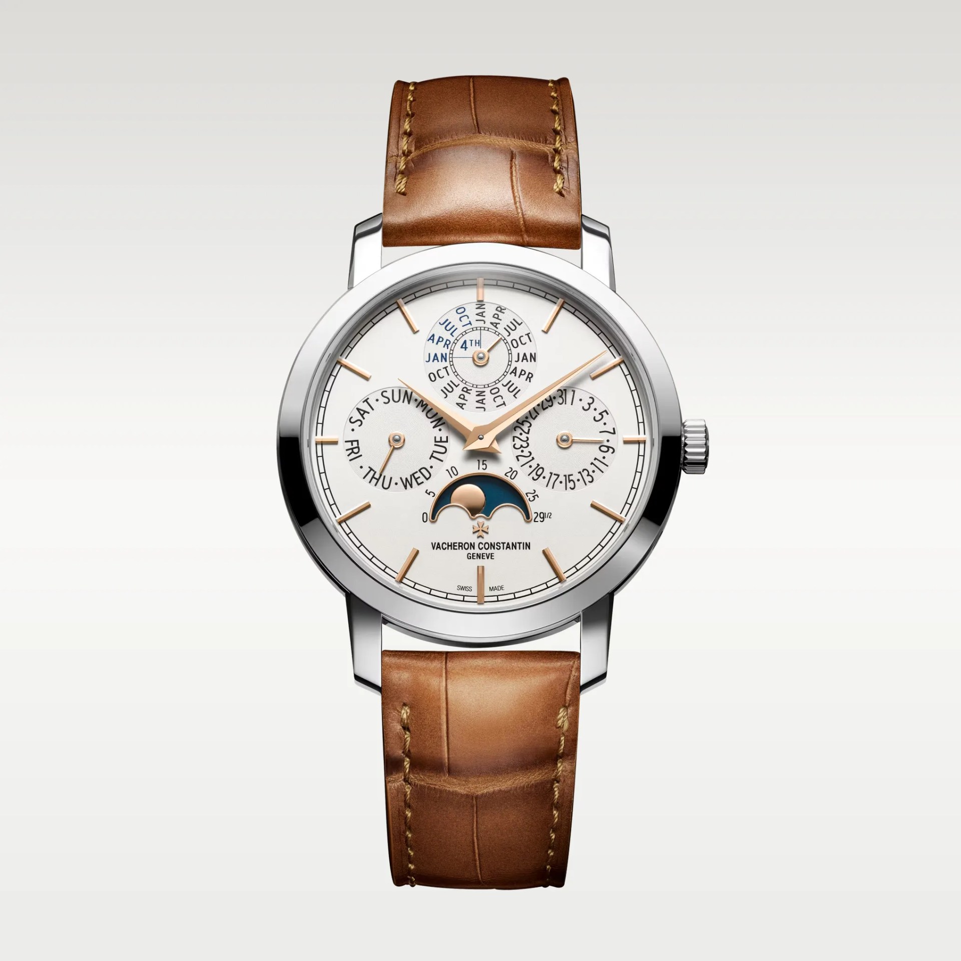 Silver Vacheron Constantin wristwatch with white dial, moon phase indicator, and brown leather strap.