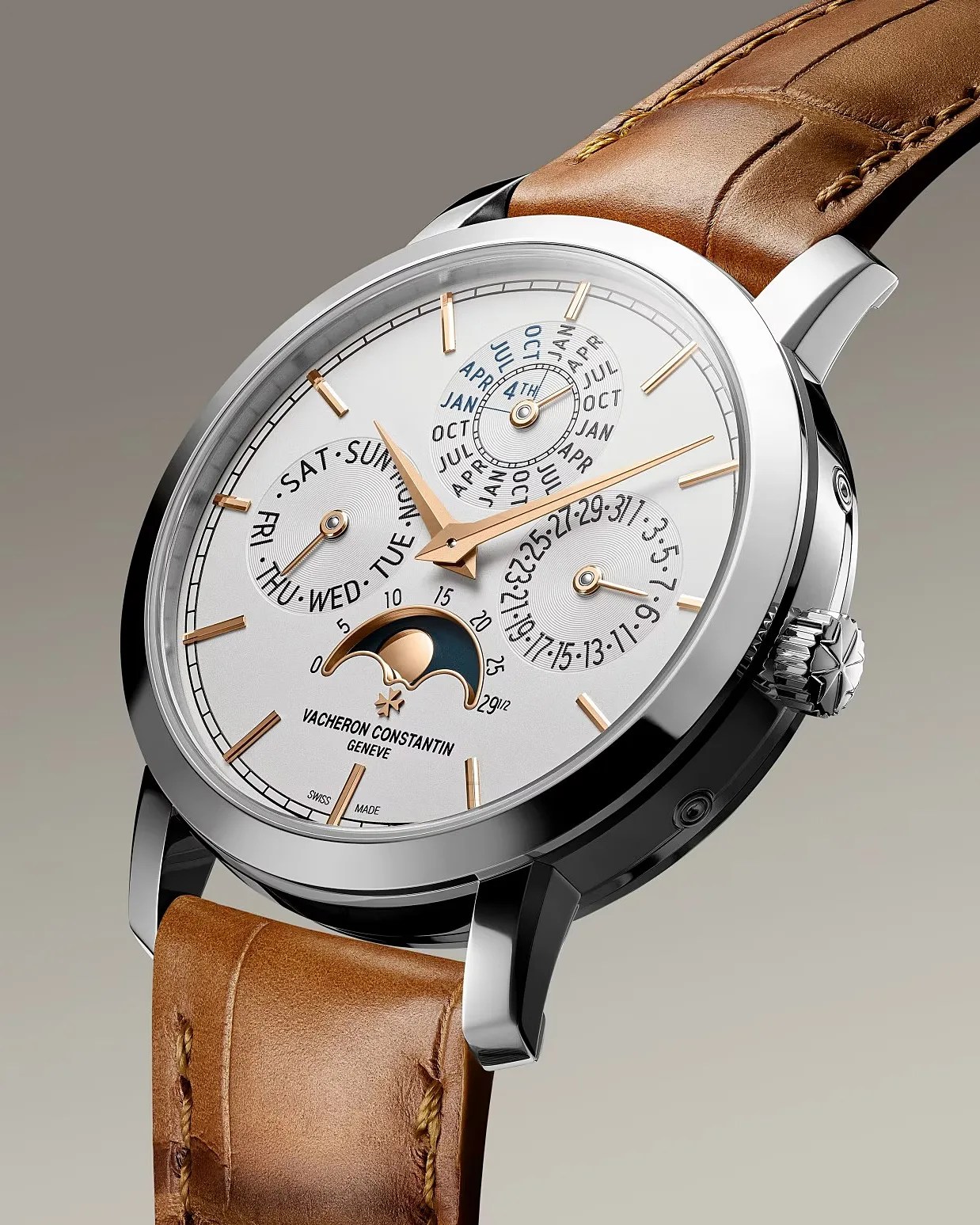 Silver Vacheron Constantin wristwatch with brown leather strap, featuring day, date, month, and moon phase indicators.