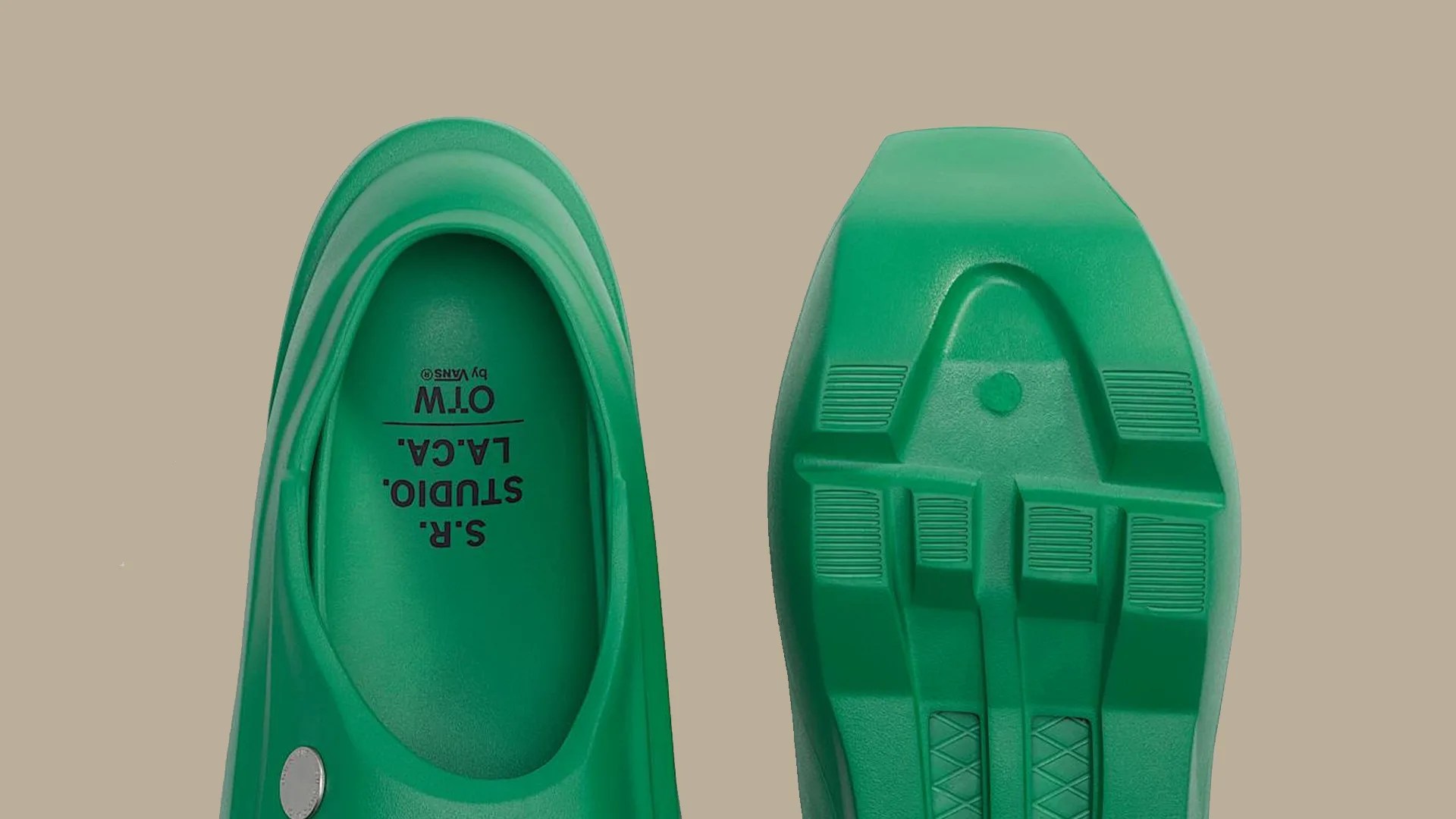 Pair of green slip-on shoes with textured soles and "S.R. STUDIO. L.A. CA. OTW by VANS" printed inside.
