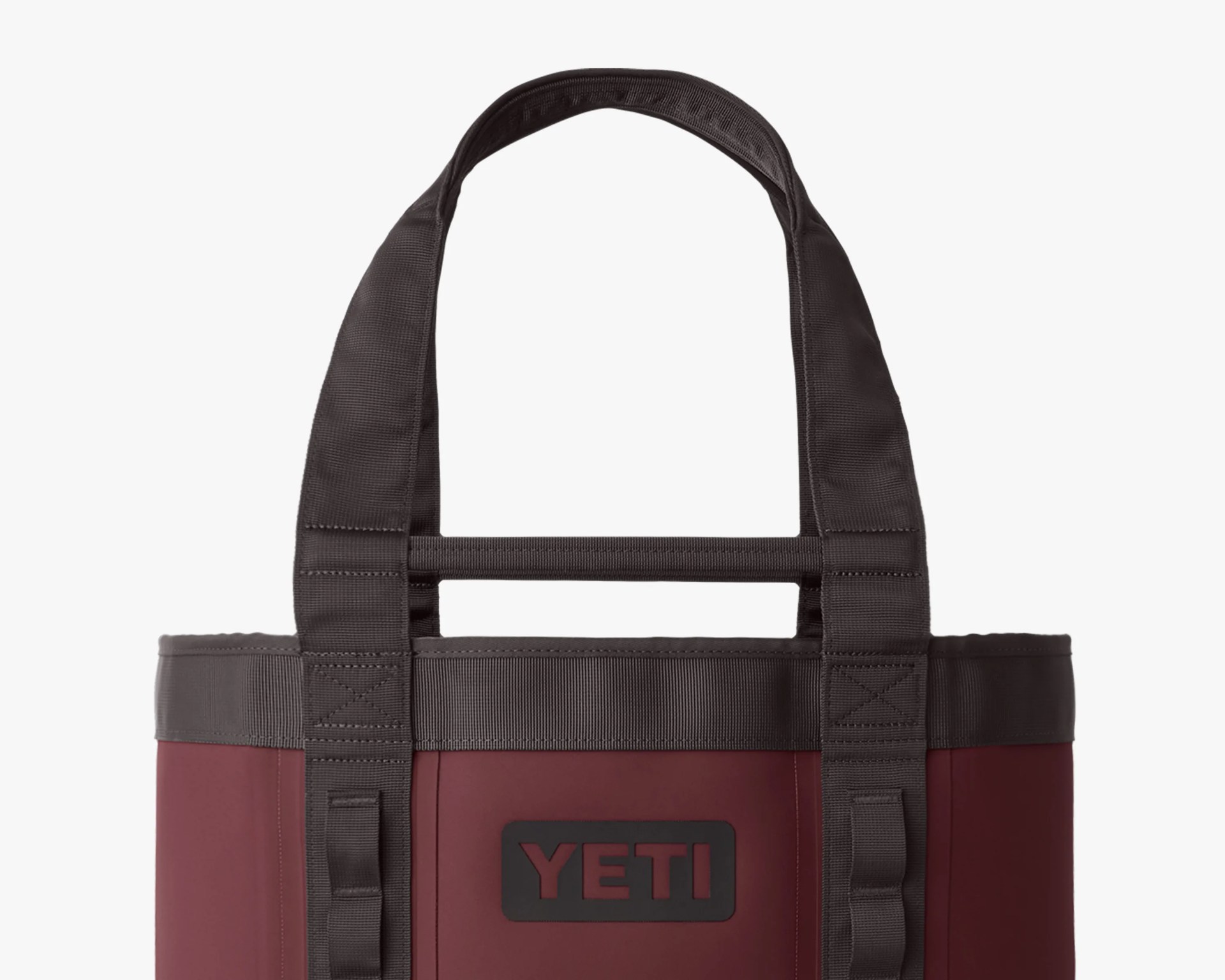 Maroon YETI tote bag with black handles and reinforced stitching.