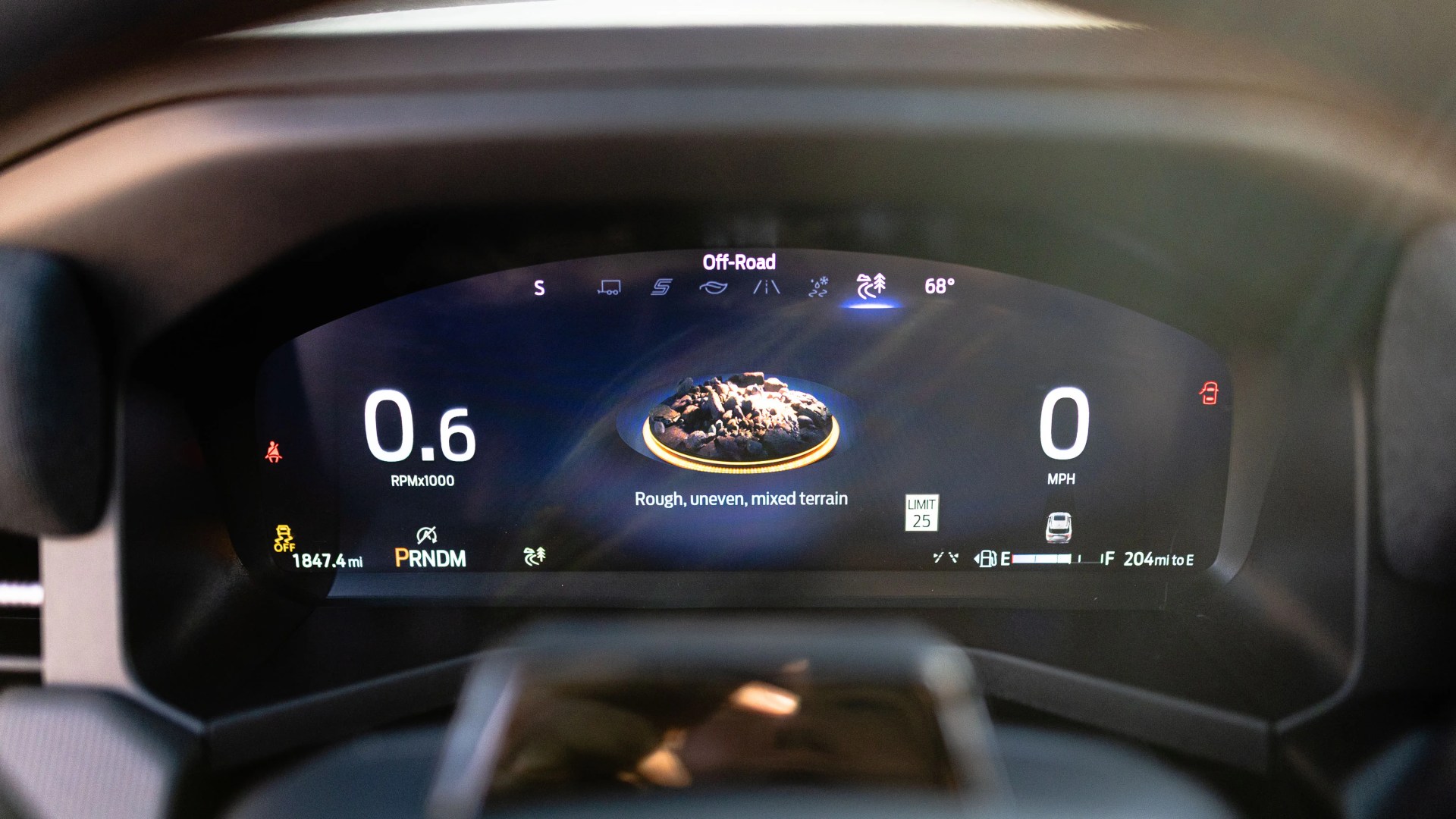 Digital car dashboard showing off-road mode with rough, uneven, mixed terrain, 0.6 RPM, 0 MPH, and 68°F.