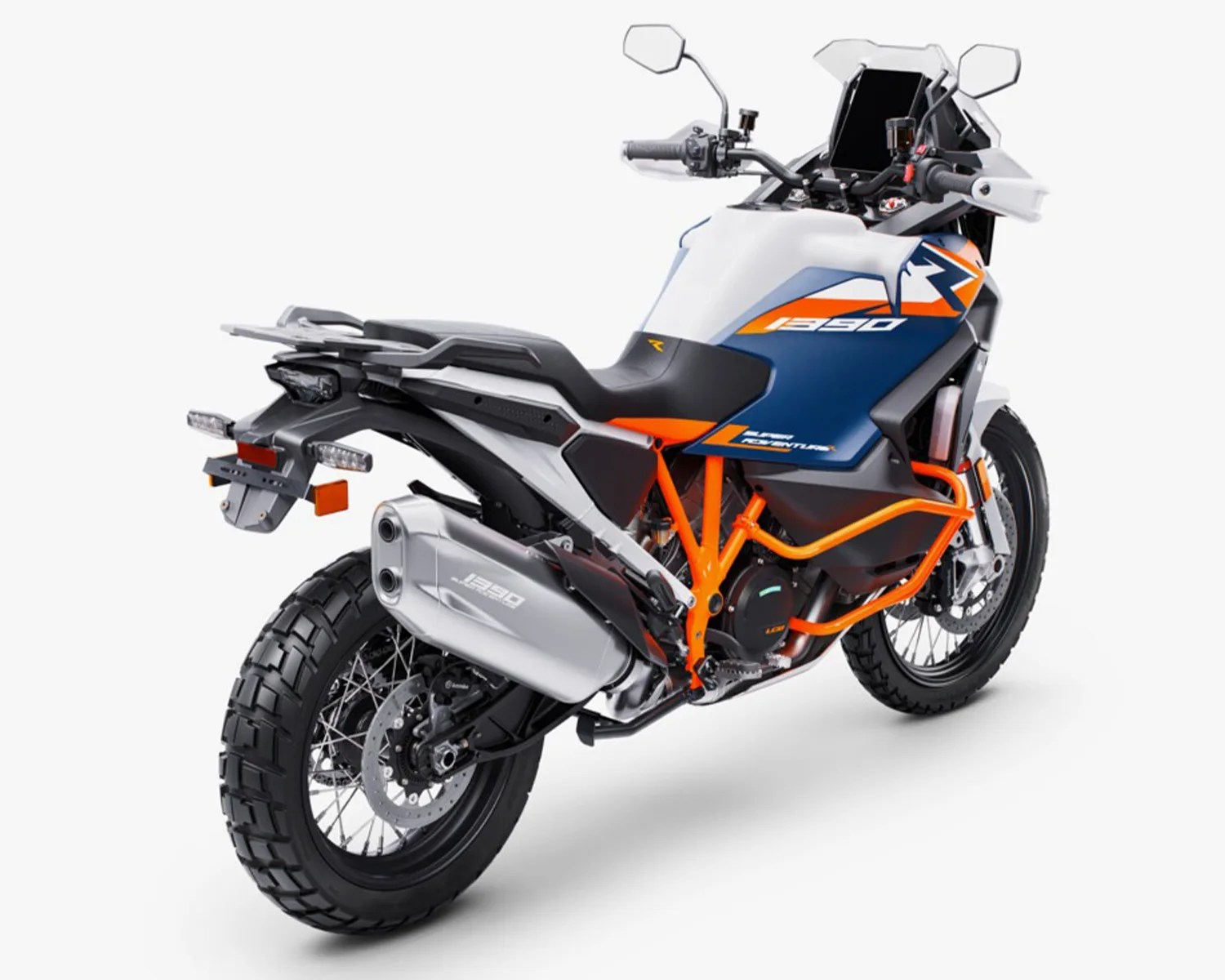 Blue, white, and orange KTM 1290 adventure motorcycle with knobby tires and dual exhaust on a white background.
