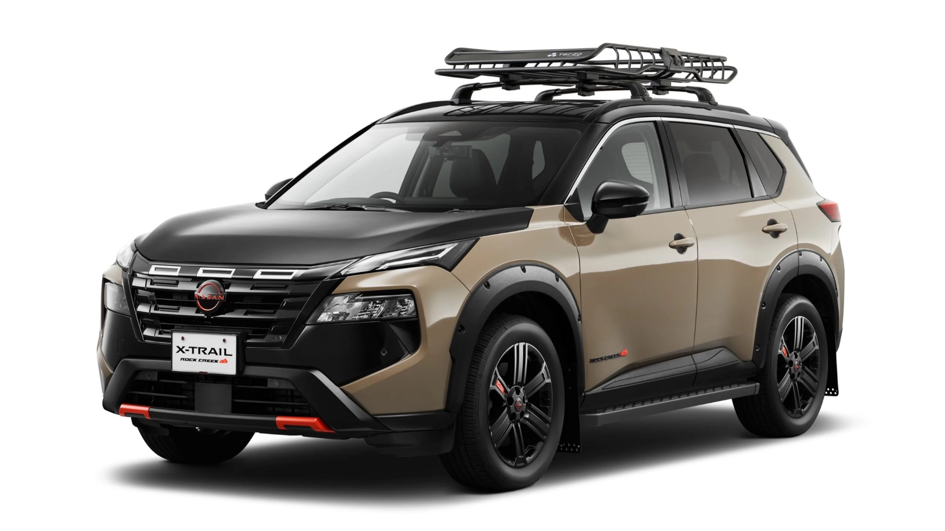 Two-tone beige and black Nissan X-Trail SUV with roof rack and black alloy wheels on a white background.