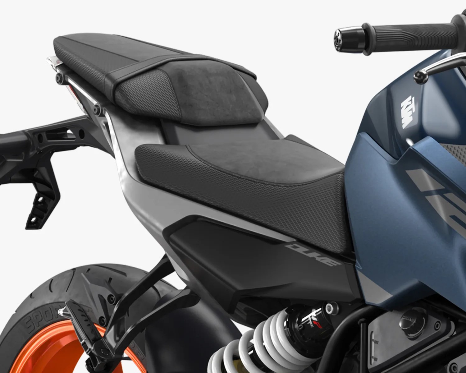 Close-up of a black and gray motorcycle seat with textured padding and a blue fuel tank with KTM logo.