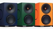 Three rectangular speakers in navy blue, forest green, and bright orange with black circular drivers and copper-colored tweeters.