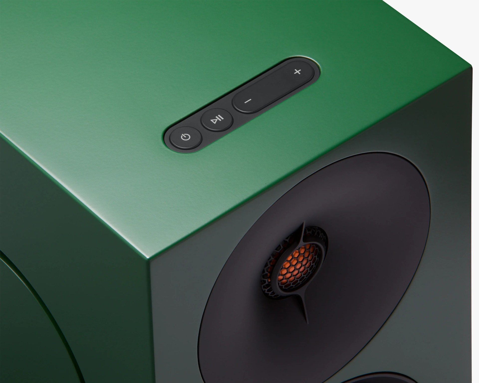 Green rectangular speaker with black circular driver and control buttons on top.