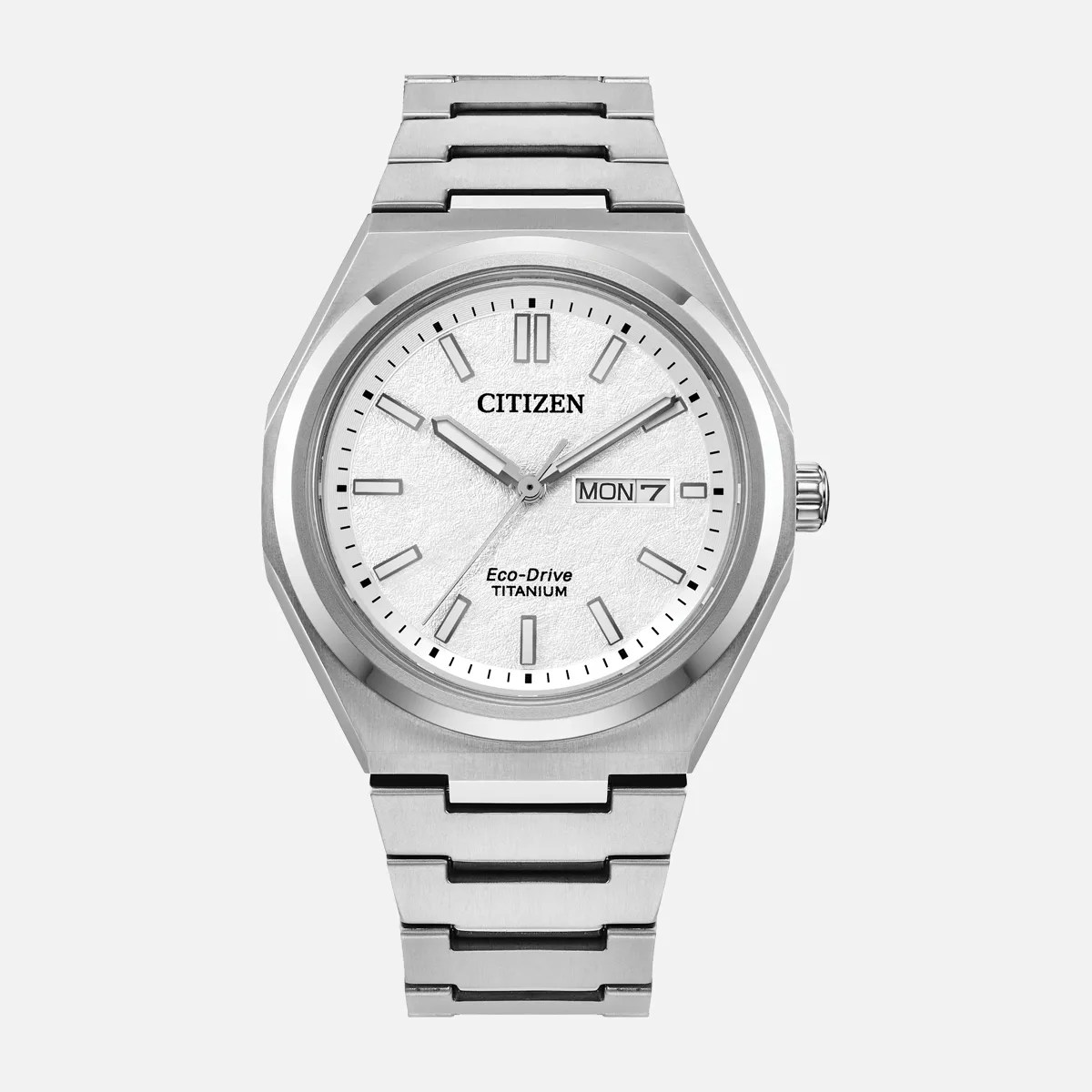 Silver Citizen Eco-Drive titanium wristwatch with white textured dial and day-date display.