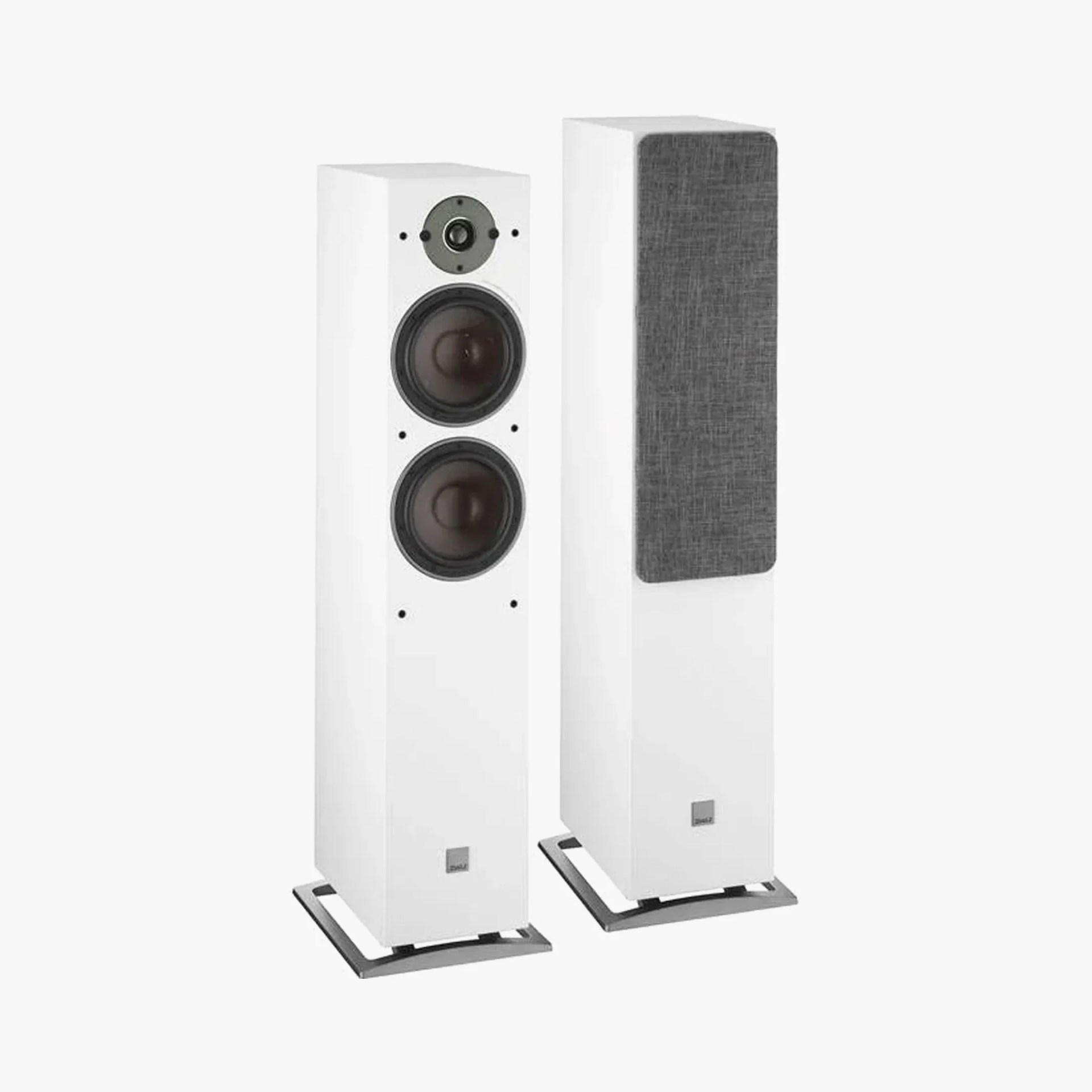 Pair of white floor-standing speakers, one with gray fabric grille and the other showing two black woofers and a tweeter.