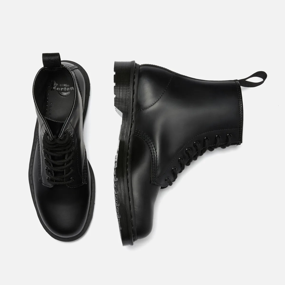 Pair of black leather lace-up boots with thick rubber soles, one shown from top and the other from side.