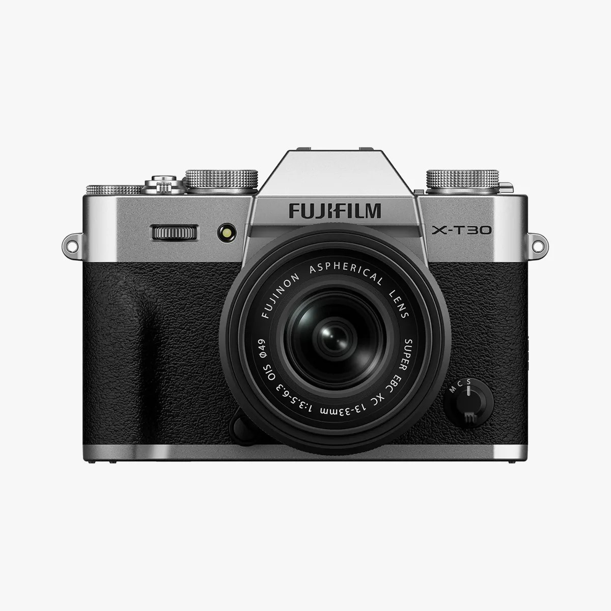 Silver and black Fujifilm X-T30 mirrorless camera with Fujinon 13-33mm lens facing forward.