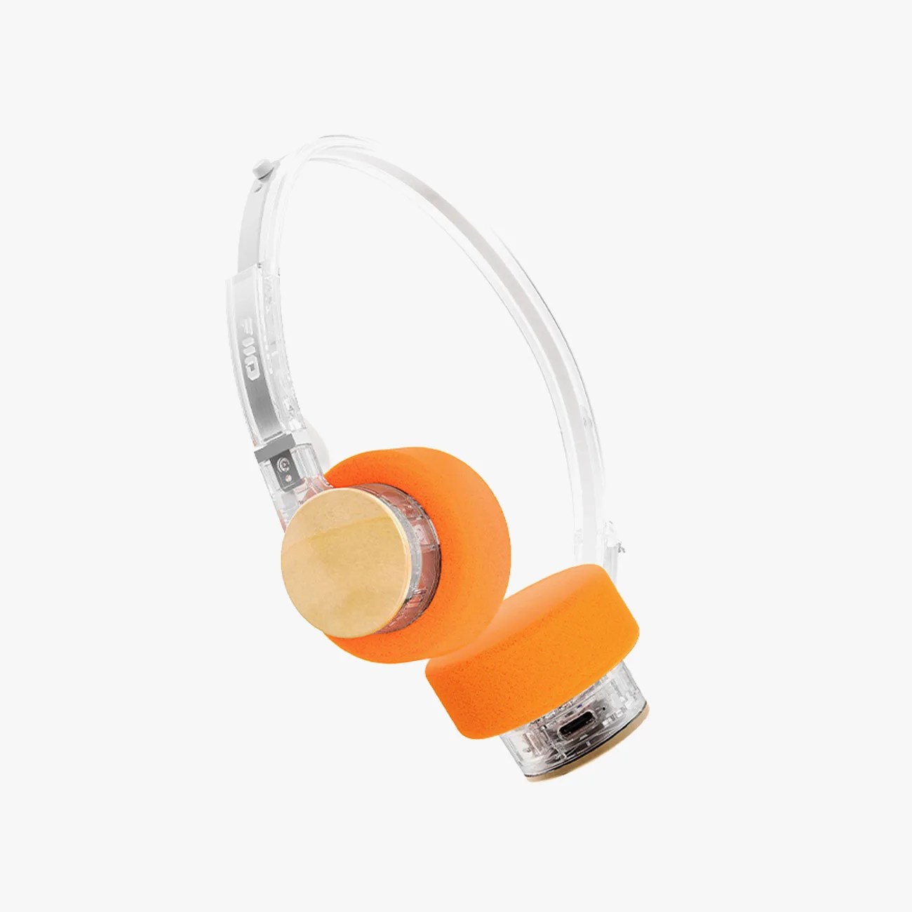 Transparent over-ear headphones with orange foam ear pads and wooden circular accents.