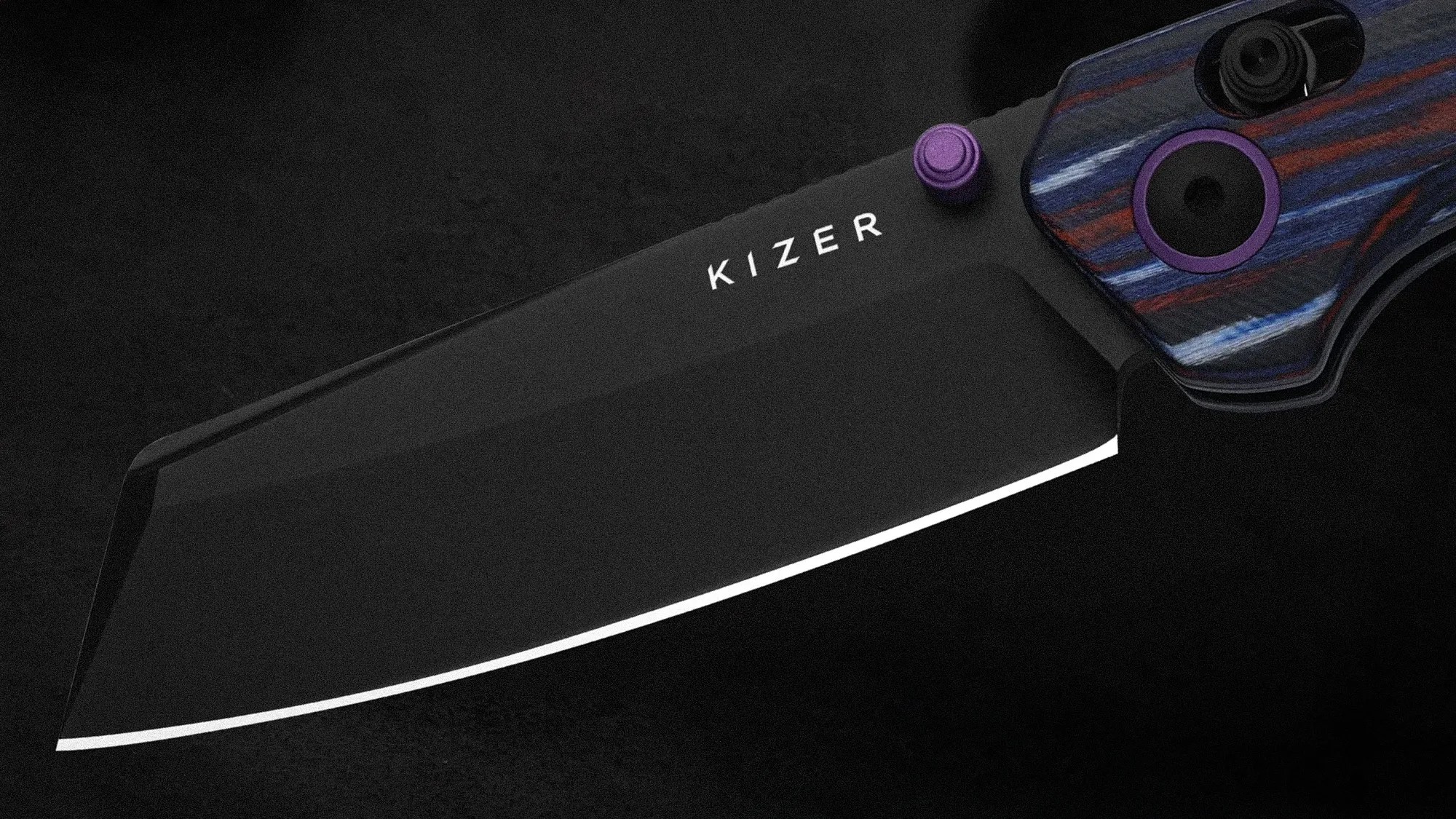 Black Kizer folding knife blade with purple thumb stud and blue and red striped handle.