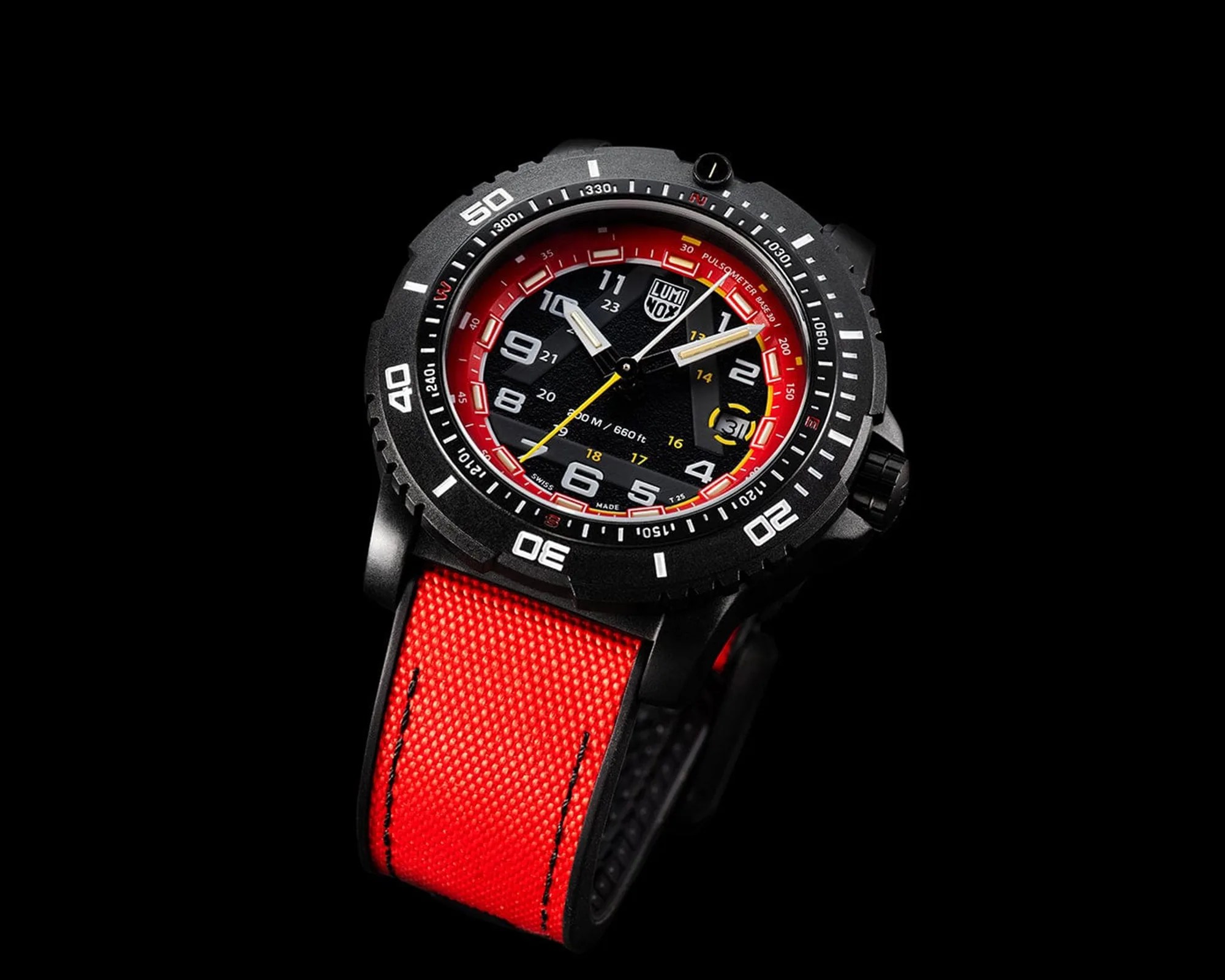 Black Luminox wristwatch with red fabric strap, black dial with white and yellow markings, and rotating bezel.